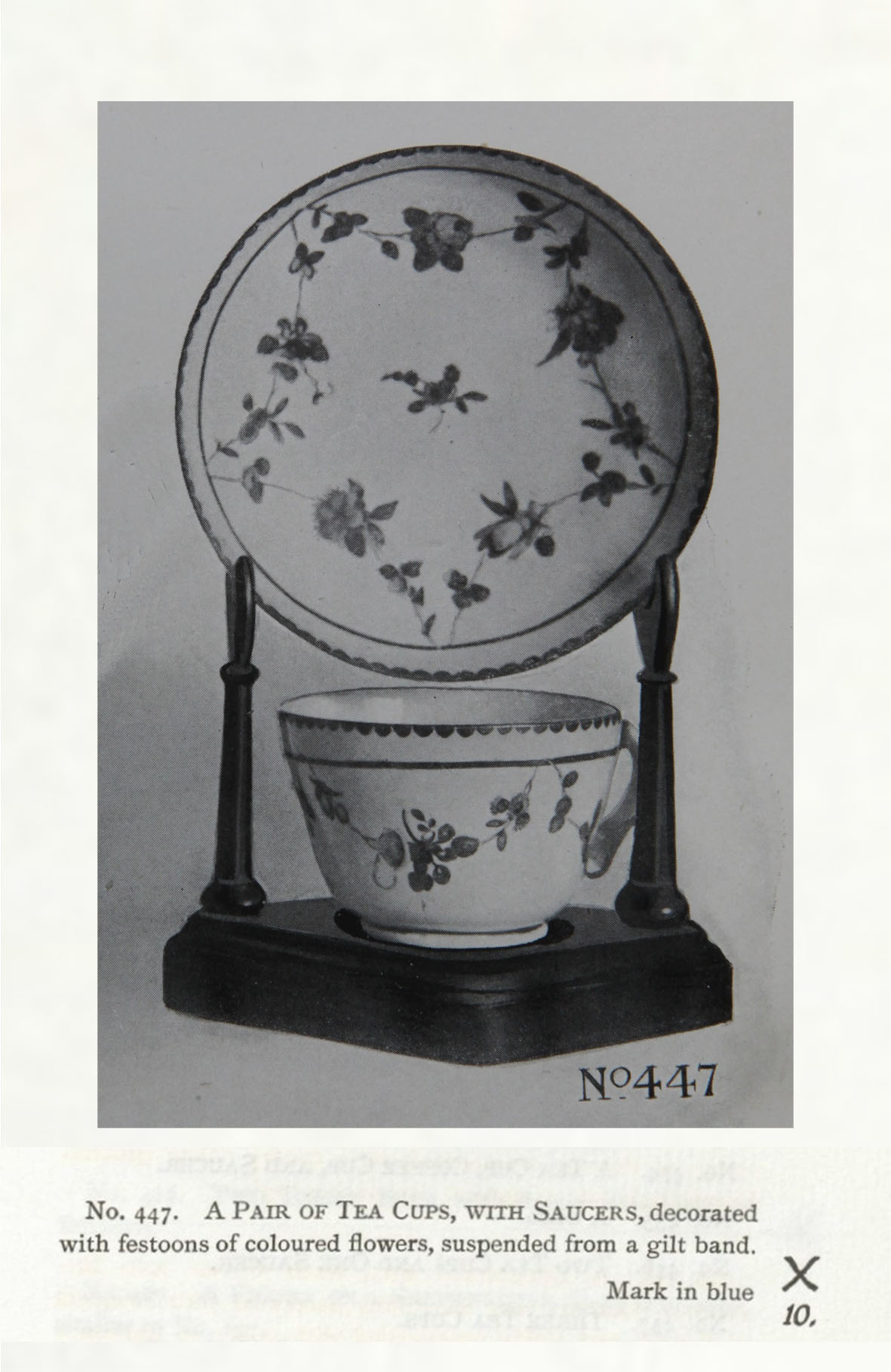 A cup and saucer with garlands looping over a gilt line, No. 447 from the Trapnell Collection