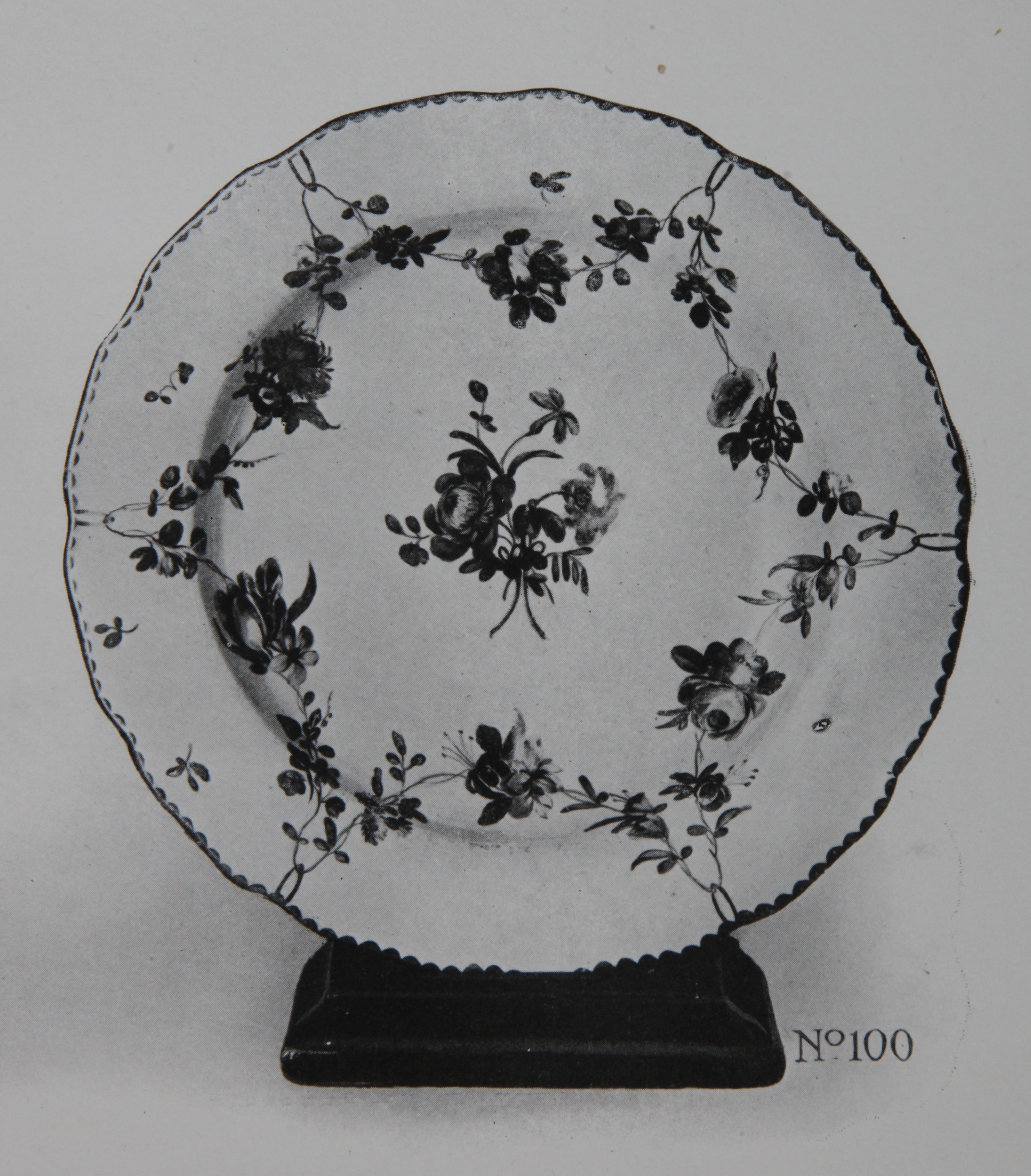 A plate with garlands suspended from gilt loops, No. 100 from the Trapnell Collection