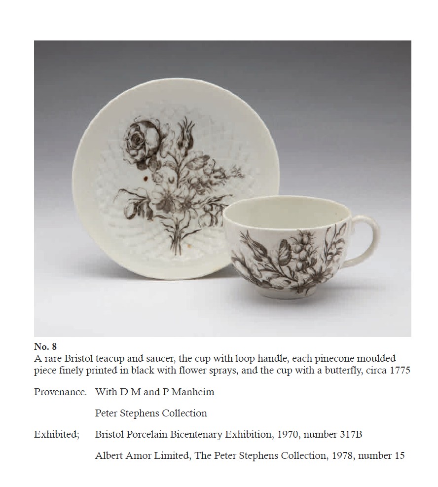 A pinecone-moulded teacup and saucer printed with floral sprays and a butterfly, from the Creed collection