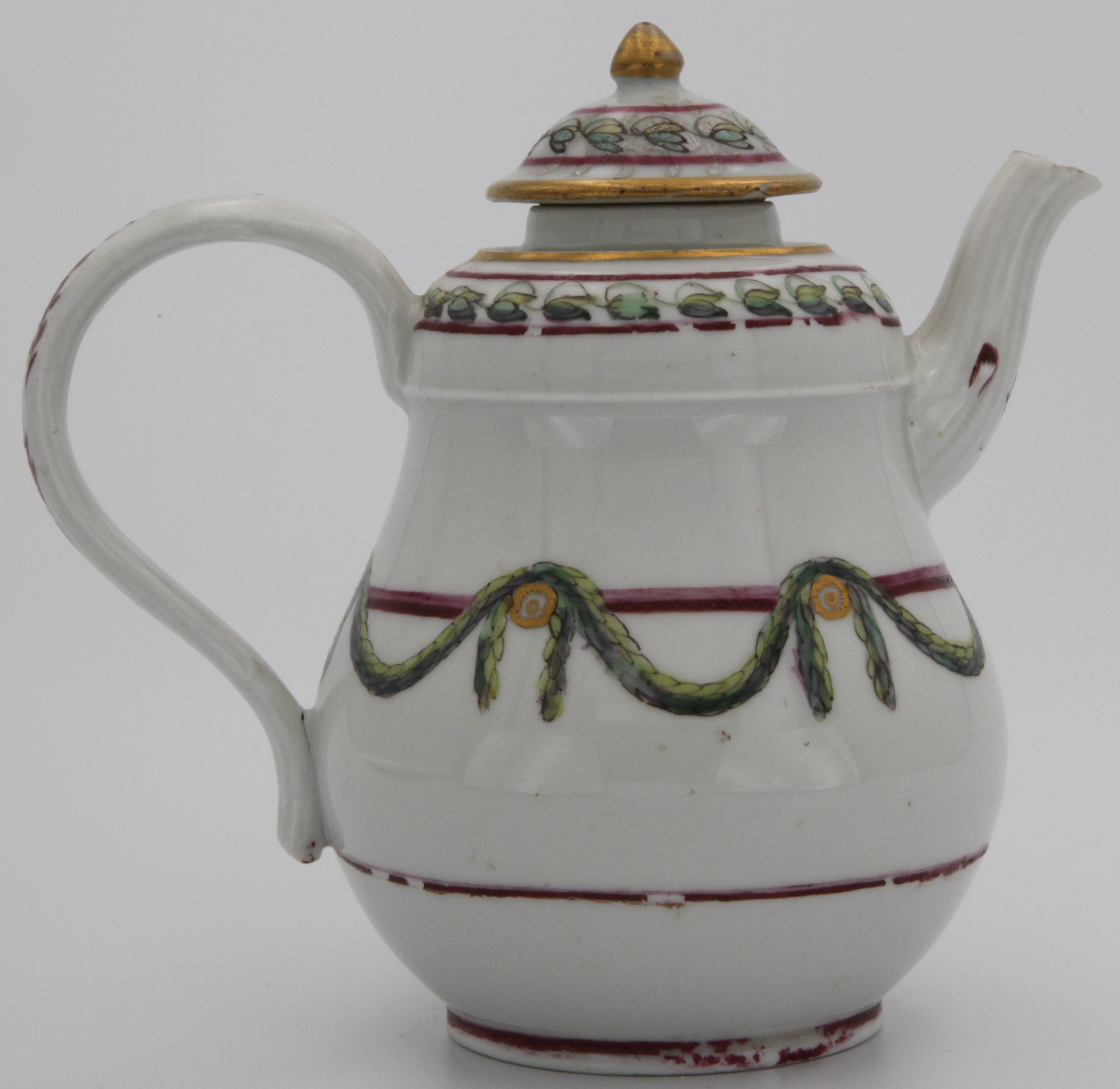 A Bristol porcelain teapot of bulbous baluster form, with ear-shaped twig-moulded handle and cover (possibly replacement) all decorated with green laurel swags suspended from gilt roundels hanging on a puce and purple bands, a band of harebells between purple lines and gilt rim line.  No mark