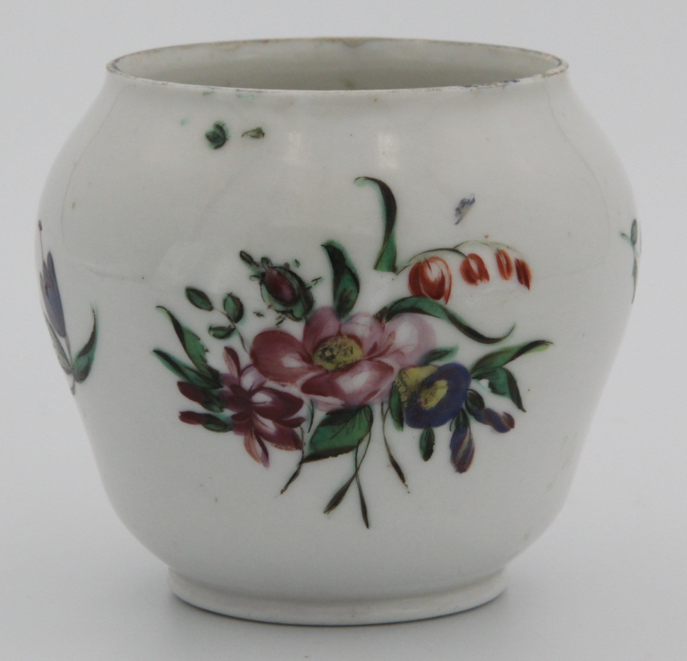 A Bristol toilet/ointment pot of ogee form, painted in enamels with flower sprays, sprigs and scattered leaves, crossed swords and gilt B6. marks.