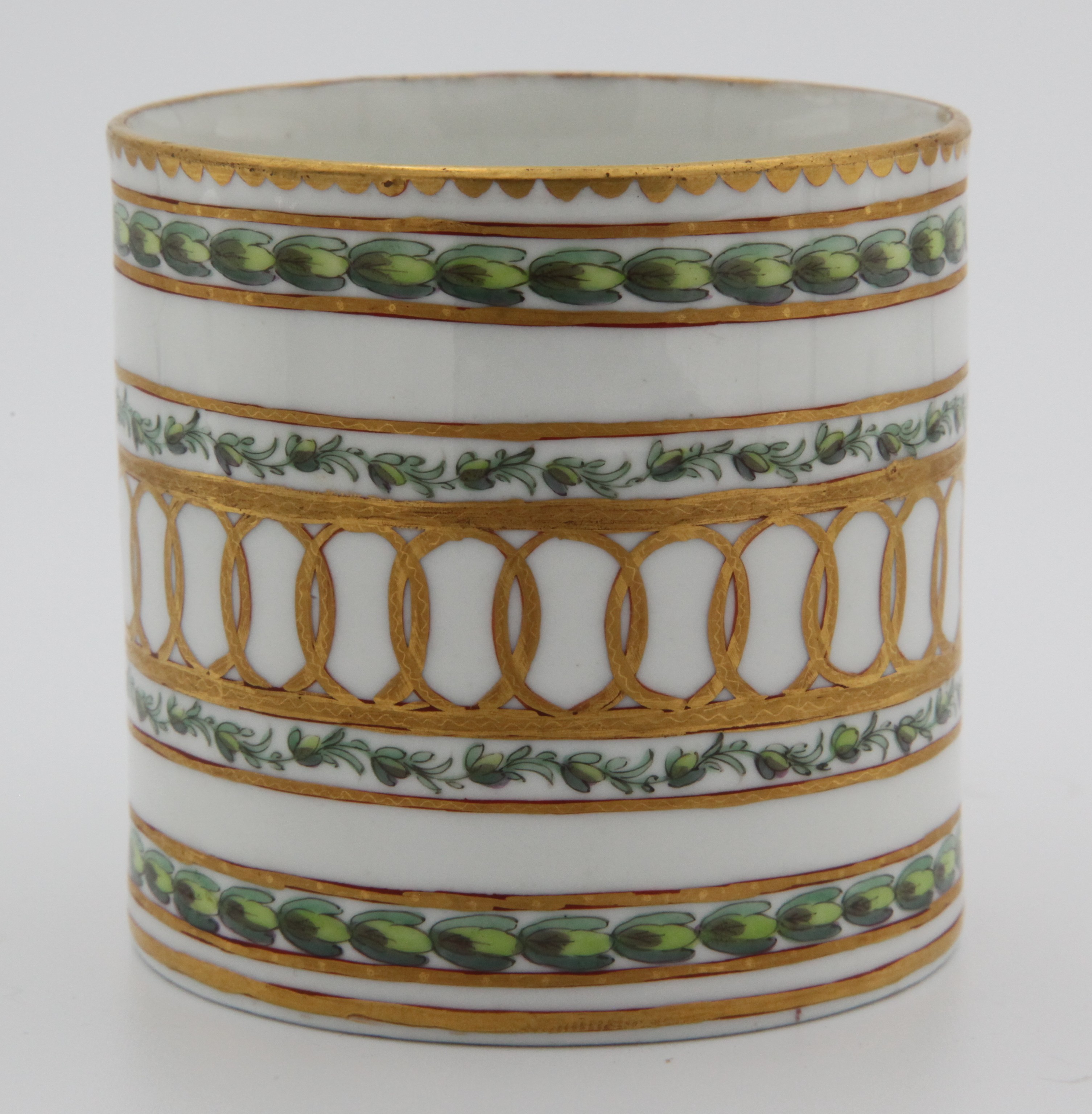 A fine Bristol cabinet cup with bands of gilding and laurel leaves, with faceted loop handle with harebell moulding decorated in gilt,  painted in green and puce with bands of leaves, within gilt line and interlinked roundel bands, gilt dentil rims,  Bristol blue X mark and numeral 1 in red, c.1775.