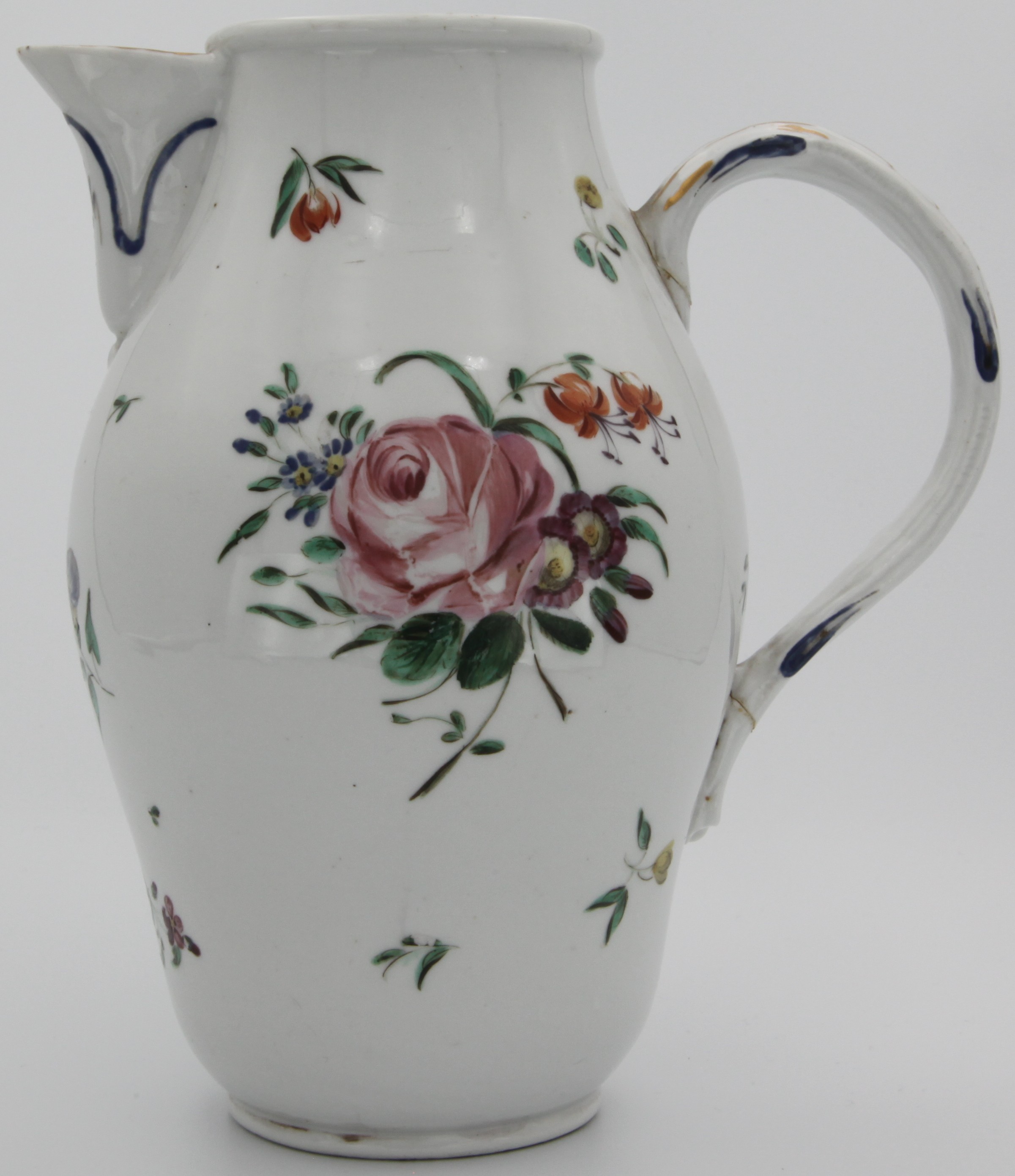 A large Bristol jug with moulded handle and spout both painted with blue and gilt, the body painted with floral sprays and scattered flowers and leaves, blue crossed swords mark.