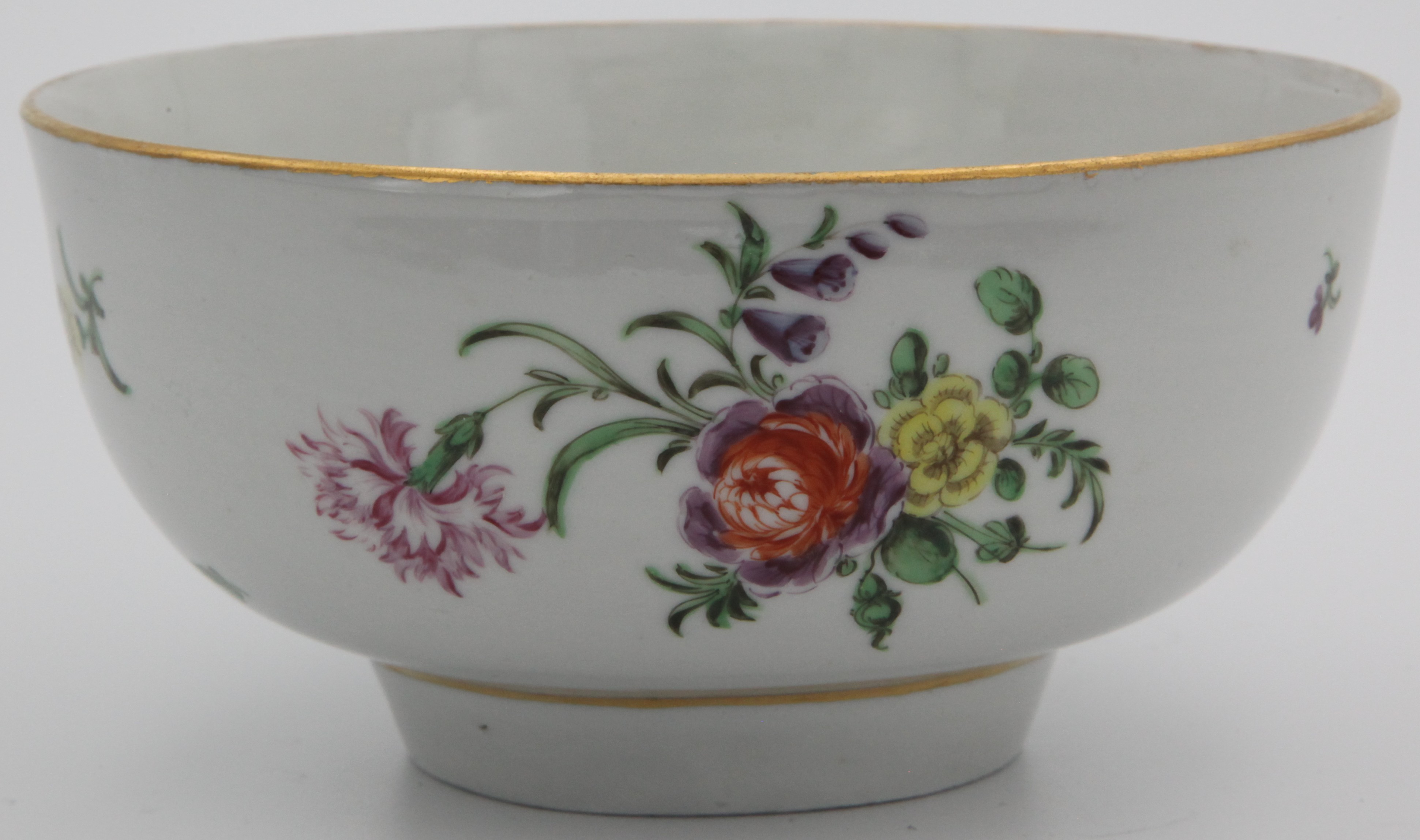 A Bristol bowl, painted in colourful enamels with spray and scattered flowers and leaves and with plain gilt rim and base line. blue X1 mark.
