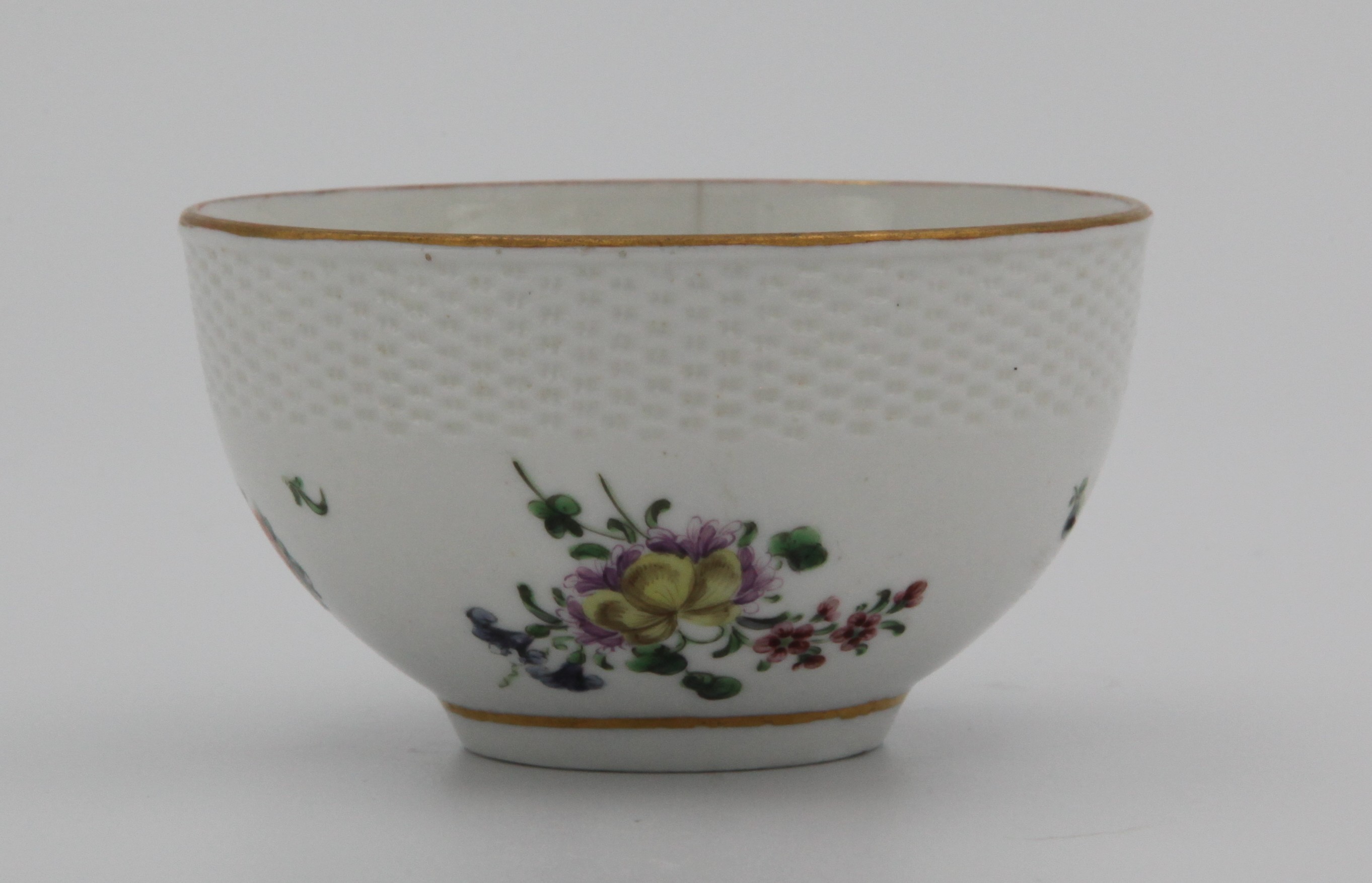 Bowl, decorated by No mark, A small Bristol bowl, the upper third with basket moulding, painted with colourful enamel spray and loose flowers and leaves between simple gilt rim and lower gilt line around base, blue X mark — Plymouth & Bristol porcelain piece 1358