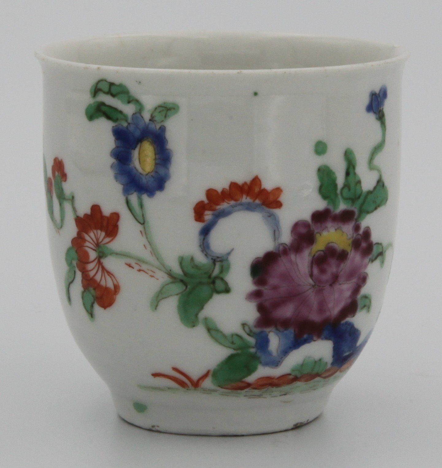 A Plymouth very rare coffee cup with a loop handle, painted in enamels with a  flowering plant, surrounded by other flowers c. 1768-70 Mark: None
