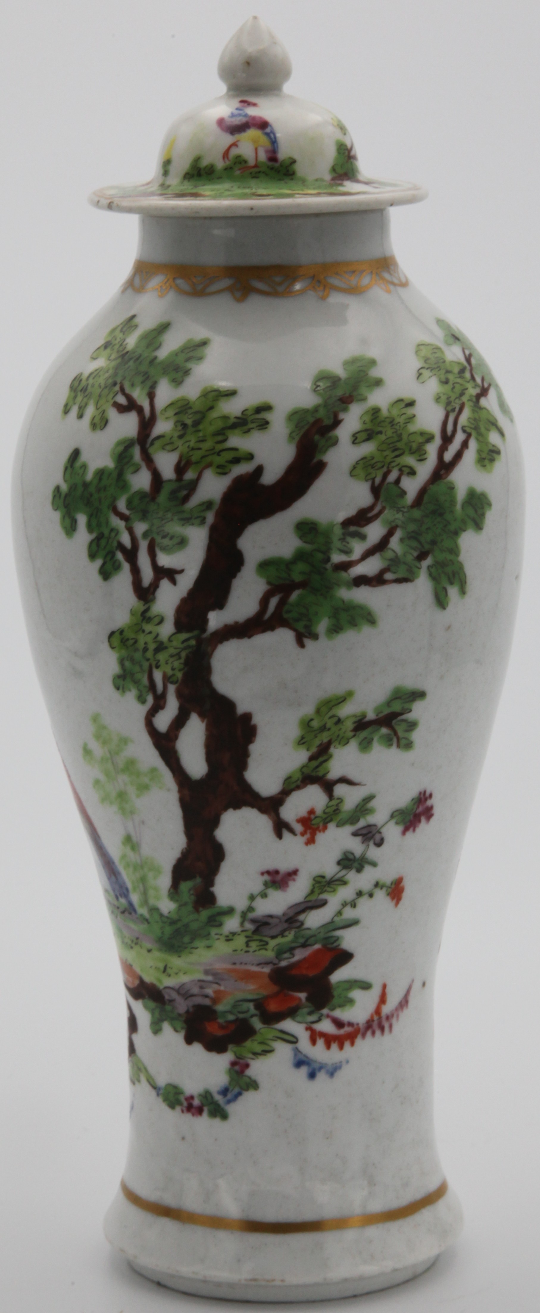 A Plymouth vase and cover painted with an exotic bird in bright colours, standing in landscape. Painted by Michel Socquet (Mons. Soqui). c. 1768-70 Mark: Tin mark in gold.