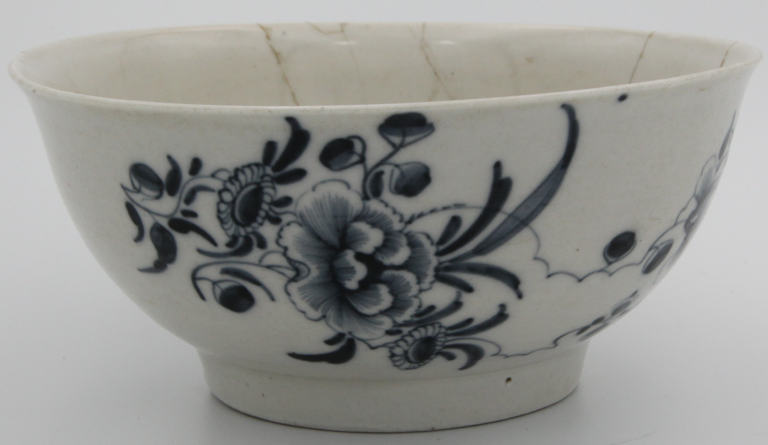 A Bristol flared cylindrical blue/white bowl, decorated in cobalt blue with stylised flowers and clouds, blue tin mark, c.1770