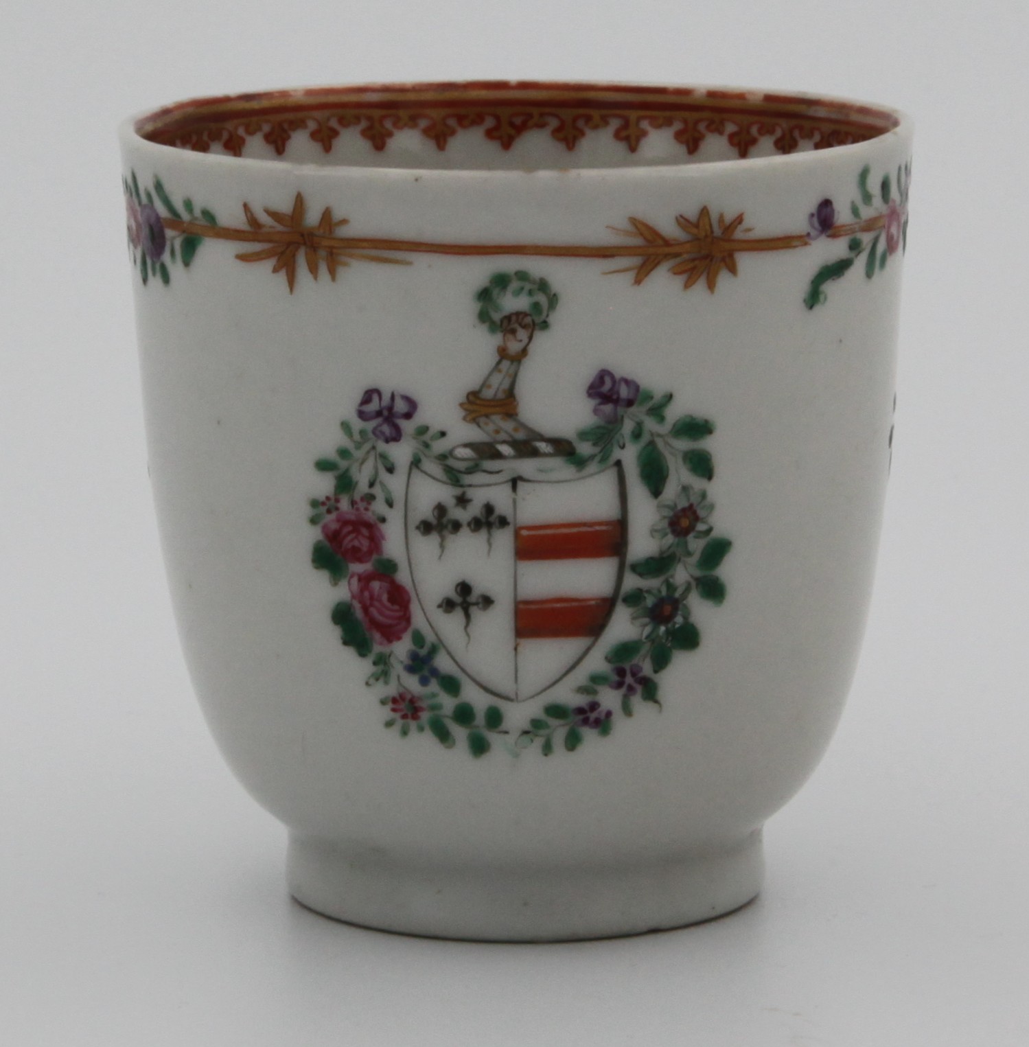 A small Chinese export armorial cup with the arms of Champion impaling Mainwaring. See David Sactuary Howard Chinese Armorial Porcelain vol. 1 N4 p388. c. 1775