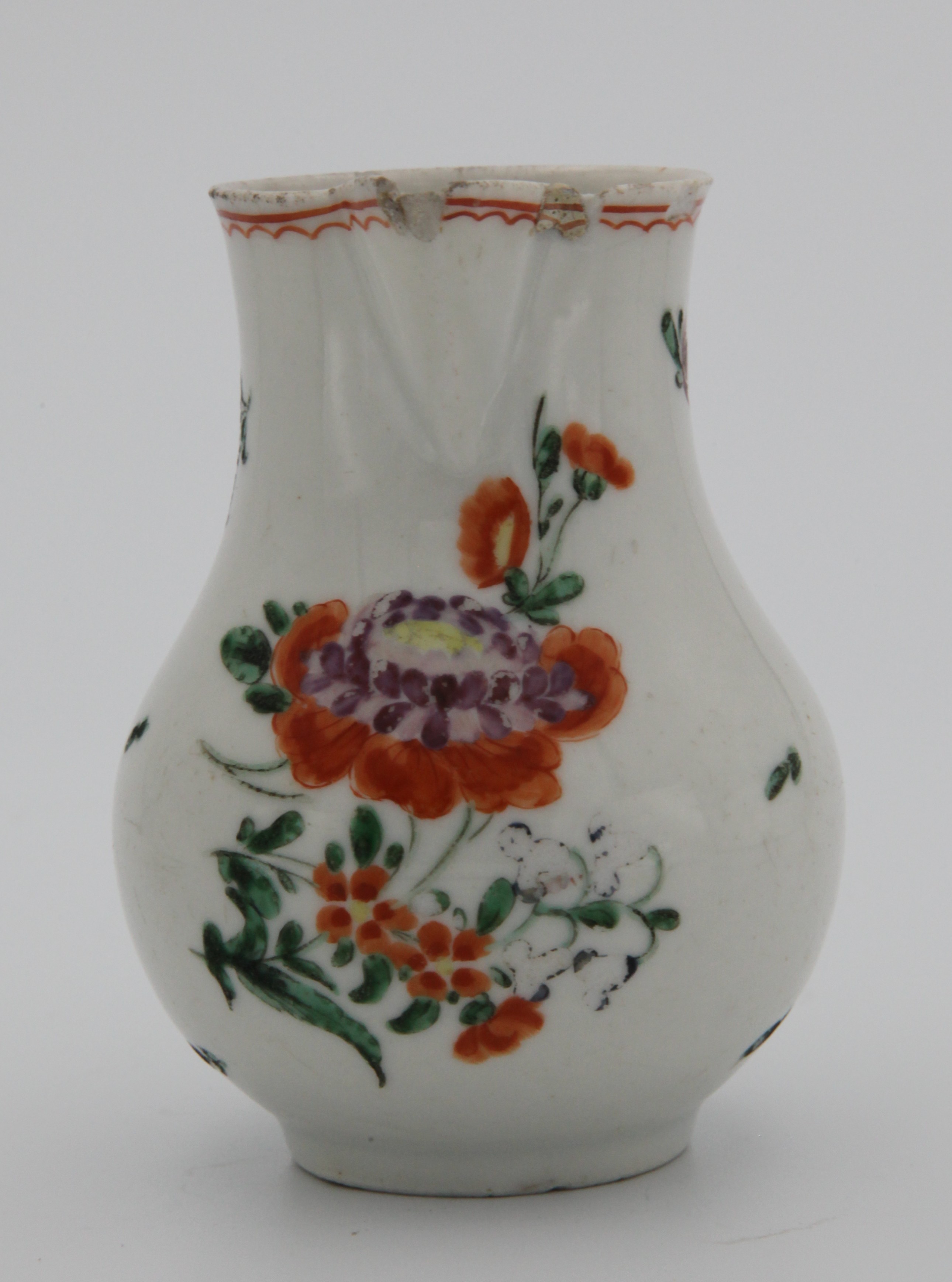 A small Plymouth sparrowbeak jug painted with orange and purple sprays of flowers and with a wavy orange band around the rim, No mark