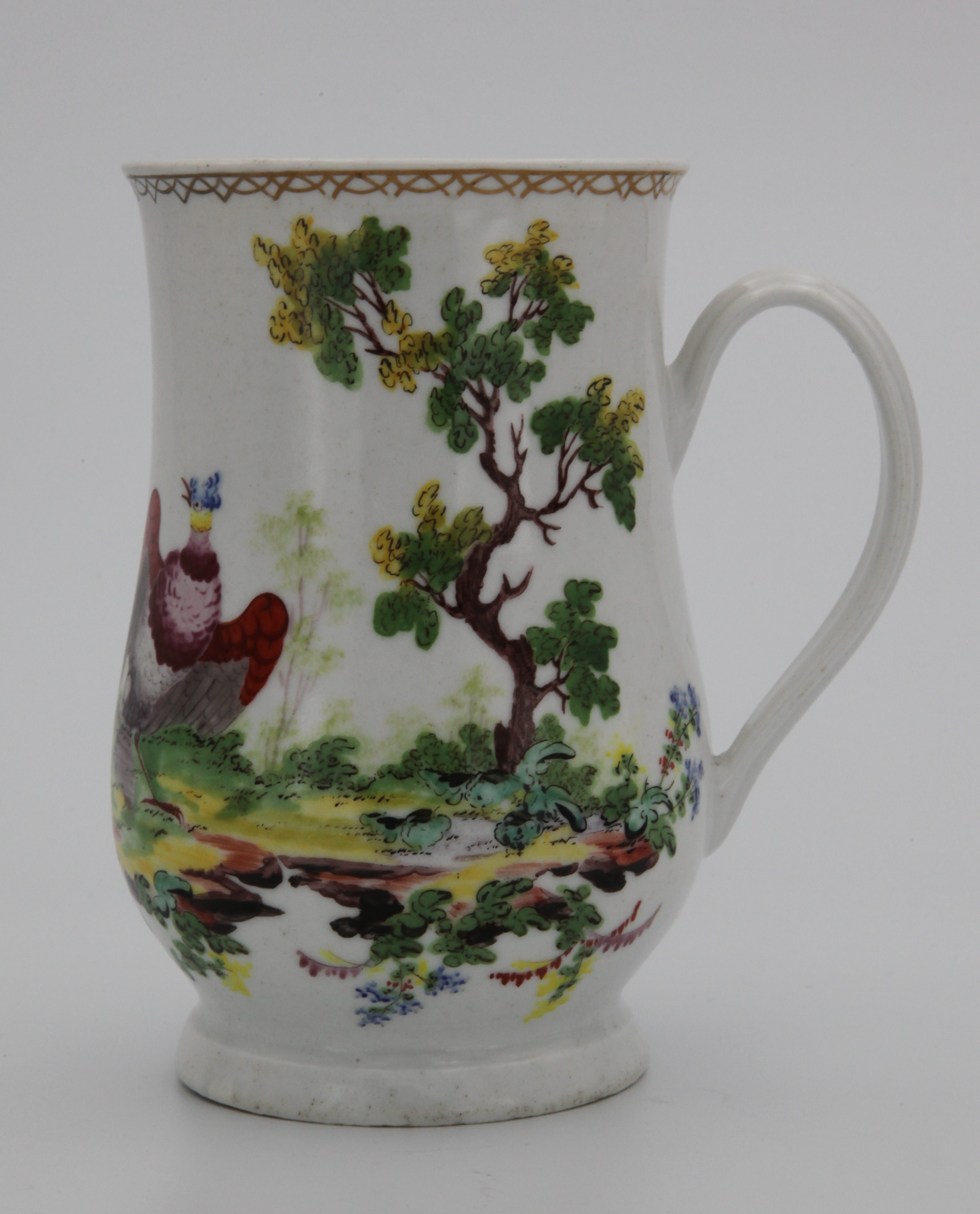 Mug, from the Mons. Soqui service, decorated by No mark, A Plymouth baluster shaped mug, with notched loop handle, painted in coloured enamels with an exotic bird in a wooded landscape, and another bird in flight, beneath a gilt interlinked band, circa 1770, red painted tin mark. This distinctive style of painting is attributed to the celebrated French painter 'Mons Soqui', now believed to be Michel Soquet, who also worked at Vincennes and Sevres — Plymouth & Bristol porcelain piece 1463