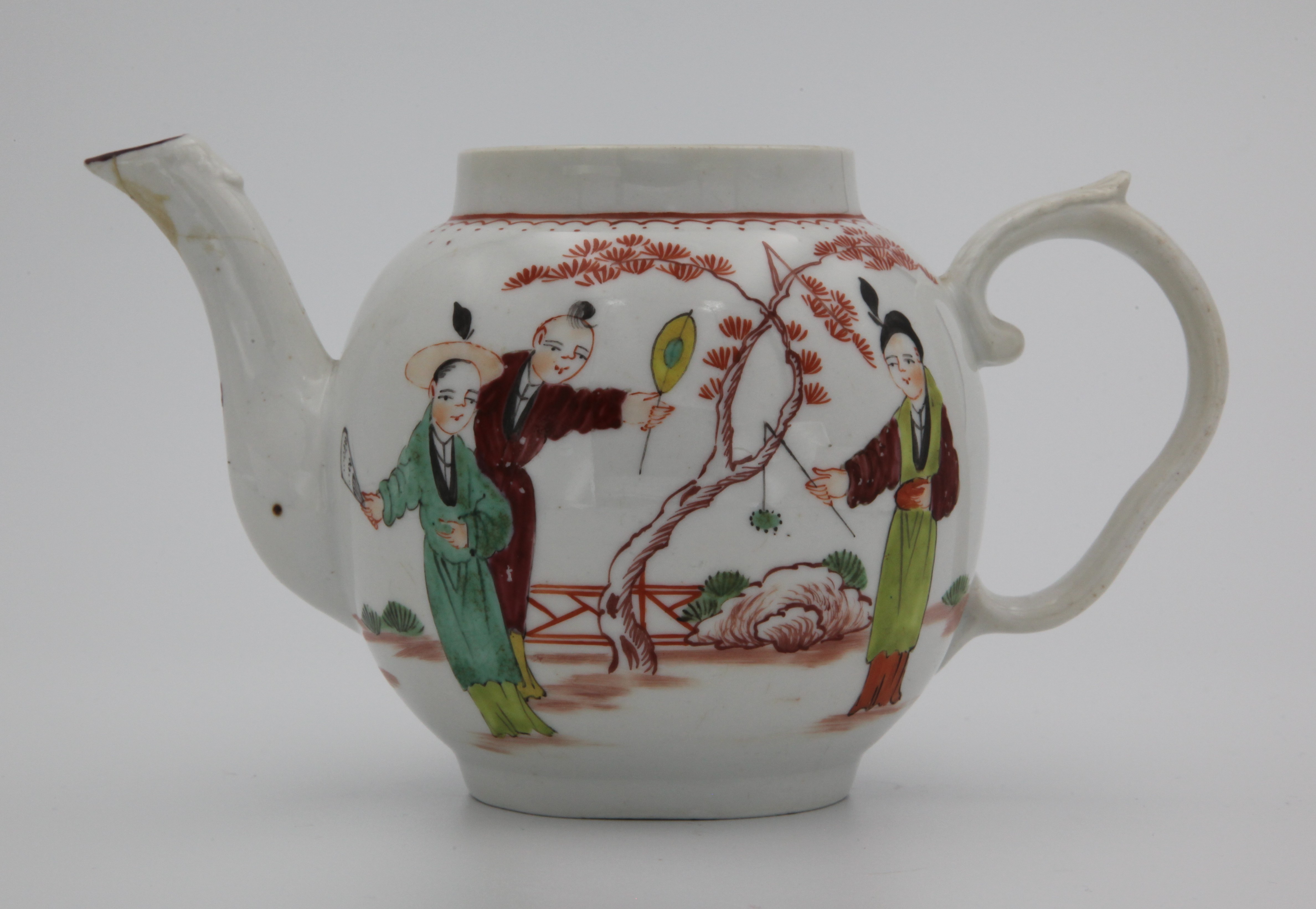 Teapot, from the Oriental service, decorated by No mark, A Bristol teapot, with ear-shaped handle featuring leafy thumb rest, painted in enamels with three Chinese figures playing a game under an orange-leafed tree, under a looping rim motif — Plymouth & Bristol porcelain piece 1474
