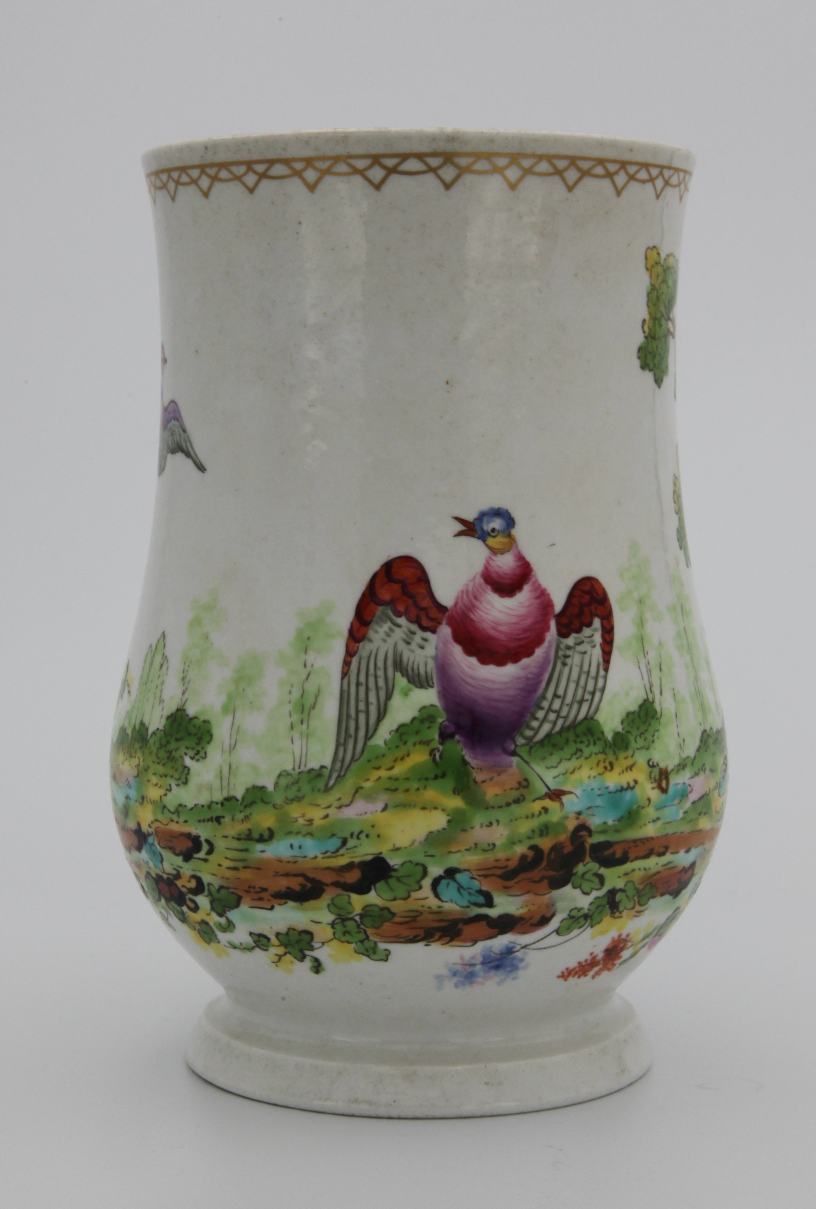 Mug, from the Mons. Soqui service, decorated by No mark, A Plymouth baluster-shaped mug, with reeded loop handle, painted in colourful enamels with exotic birds in a landscape under a gilt chain band, c1770 — Plymouth & Bristol porcelain piece 1476
