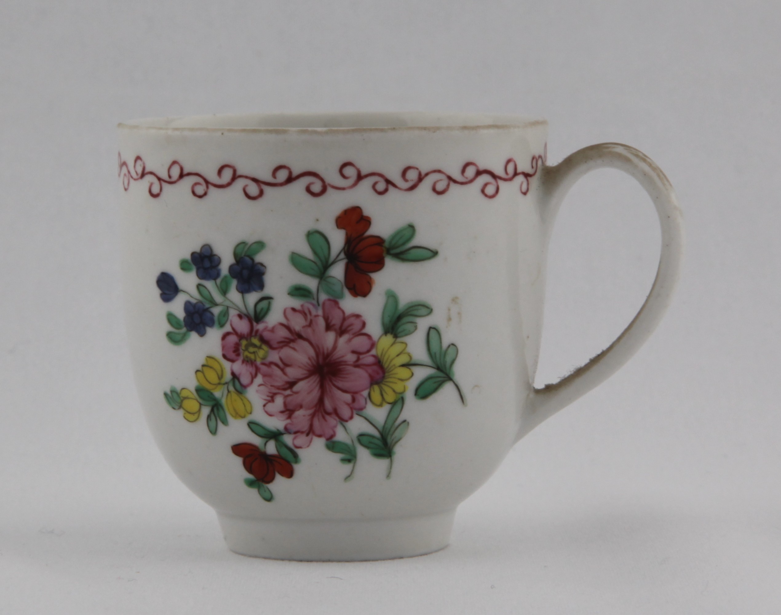 Cup, from the High numbers service, decorated by 21, A Bristol coffee cup with plain loop handle painted in enamels with a bouquet of colourful flowers under a red looping band — Plymouth & Bristol porcelain piece 1489