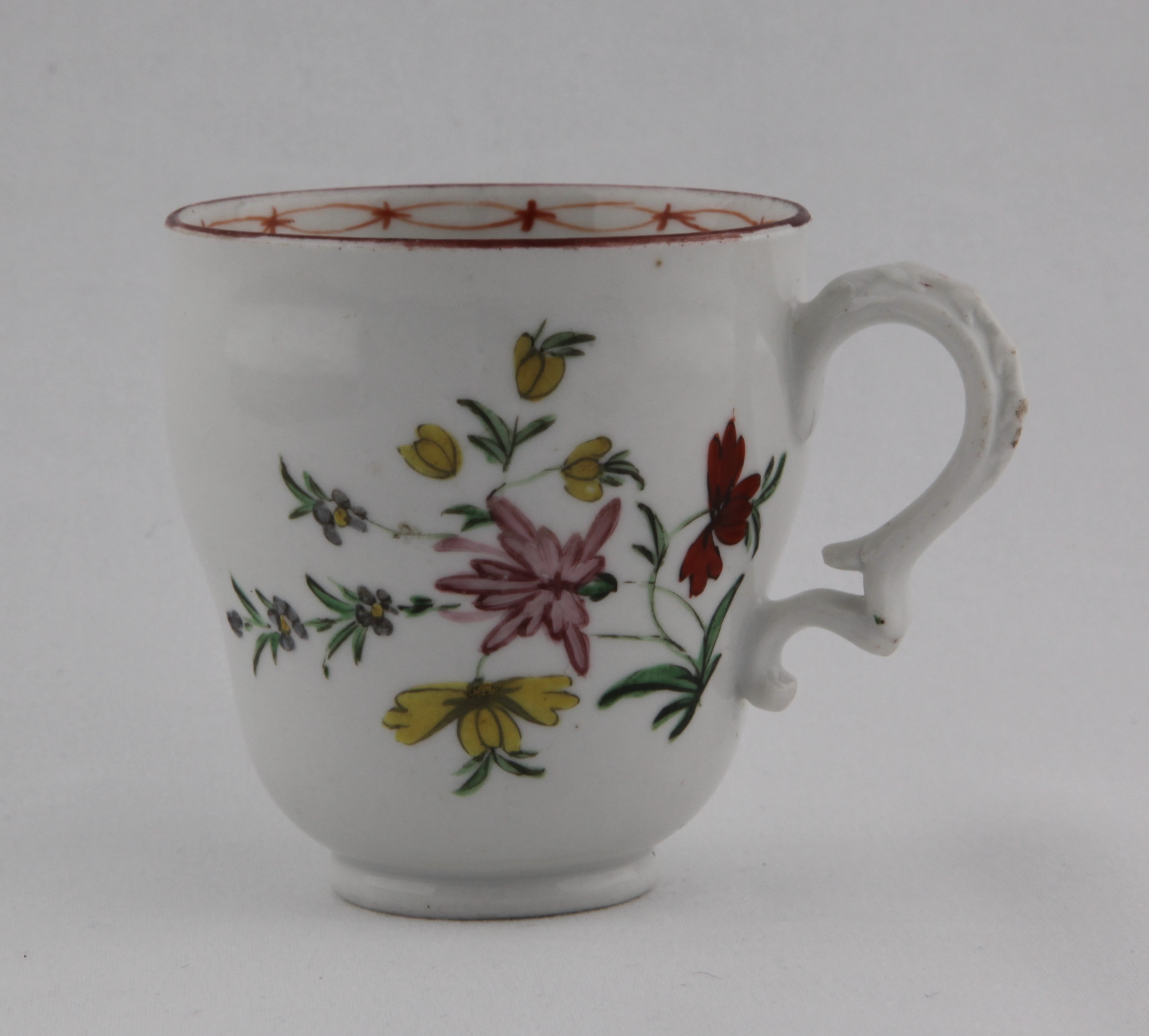 Cup, from the High numbers service, decorated by 22, A Bristol chocolate cup, of ogee shape and with harebell-moulded scroll handle, painted in enamels with floral sprays under an iron red rim line, iron red chain link band on the inside — Plymouth & Bristol porcelain piece 1503