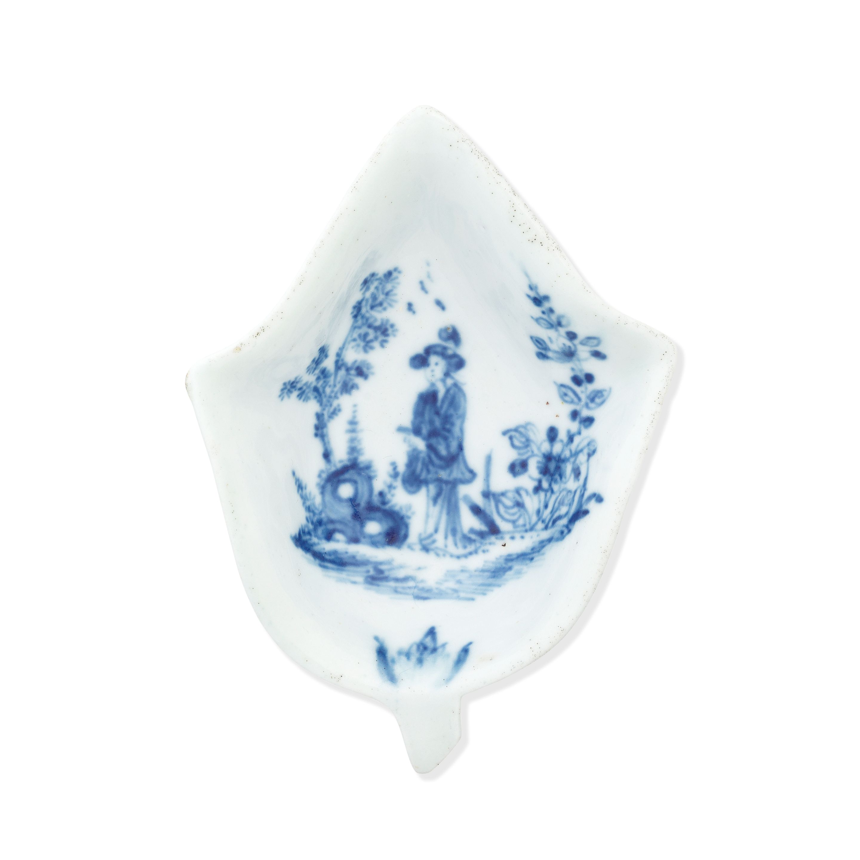 A Lund's Bristol pickle dish, circa 1750-52 modelled as a pointed ivy leaf, the underside with lightly moulded veins, painted in soft blue with the 'Pointing Chinaman' pattern, a 'Long Eliza' figure standing beside flowering shrubs and a curious rock, 10.4cm long