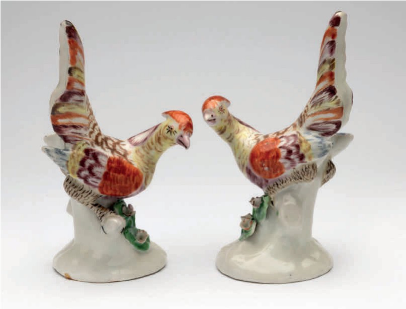 One of an extremely rare pair of Plymouth models of pheasants, each modelled with head turned, and tail feathers raised, its plumage decorated in yellow, pale blue, puce, brown and iron red, on tree-stump shaped base, applied with coloured flowers and leaves, circa 1768-70, no marks