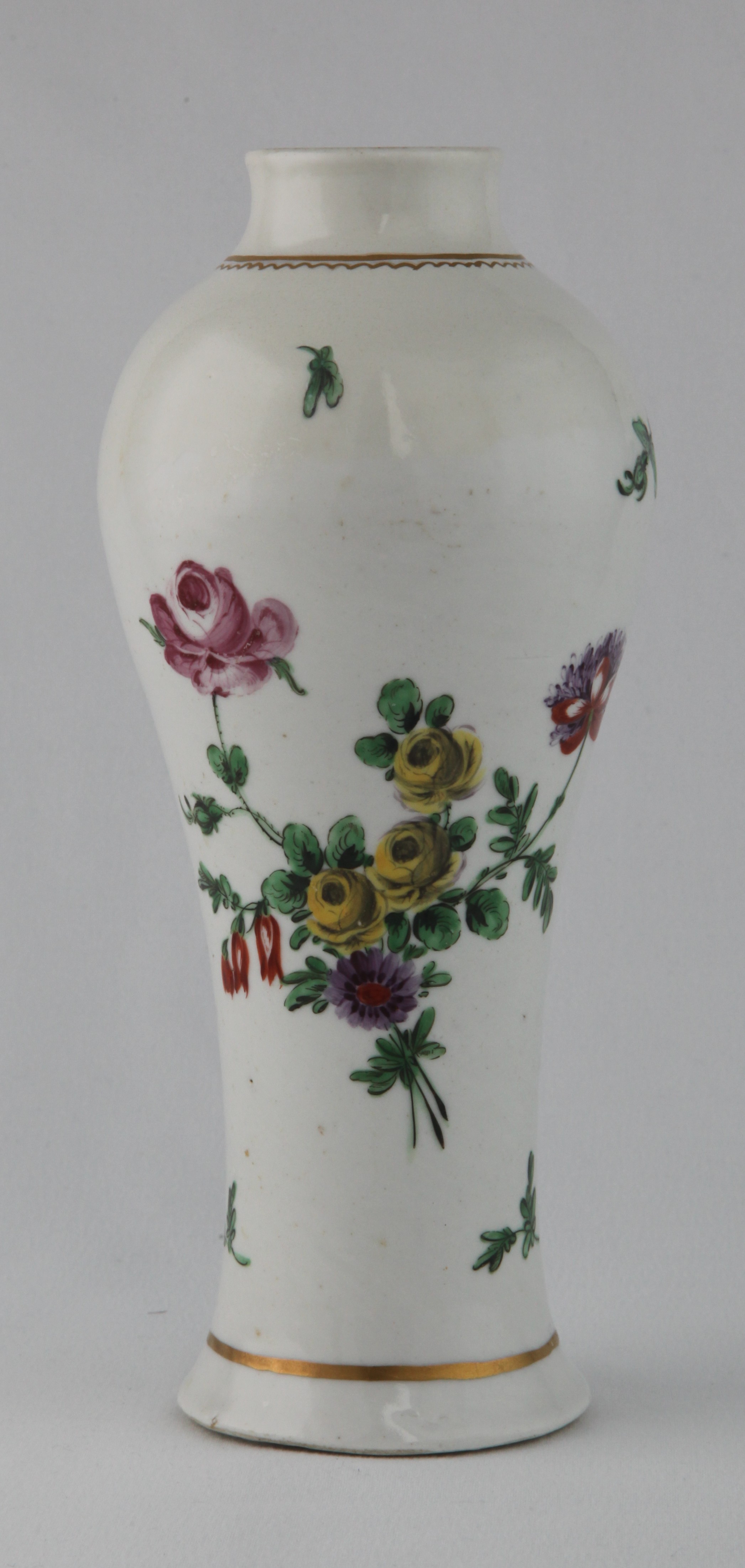 A Plymouth inverted baluster shaped vase, with slightly flared neck, brightly painted in coloured enamels with a spray of flowers and leaves, a smaller spray, leaf sprigs and a butterfly, within simple gilt borders, 8 1/4" high, circa 1770, painted tin mark in gilt