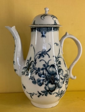 A Plymouth baluster shaped coffee pot and domed cover, with 'S' scroll handle and flower and leaf knop, painted in underglaze blue in Worcester style with the Plymouth Mansfield pattern, within diaper panelled scroll borders, 9" high, circa 1770, no mark