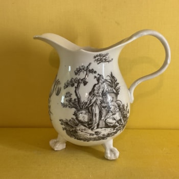 An extremely rare Bristol large baluster shaped milk jug, after a silver original, with crabstock loop handle, printed in black from an engraving by Robert Hancock with La Terre and two flower sprays, on three claw and ball feet, 5" high, circa 1775, no mark.