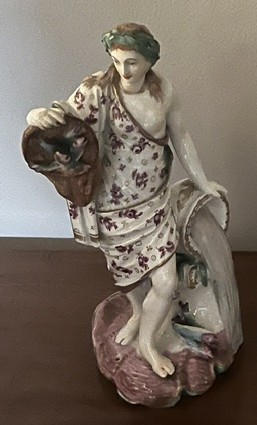 A rare Bristol figure, emblematic of Water, from the series of The Elements, decorated in coloured enamels, circa 1775
