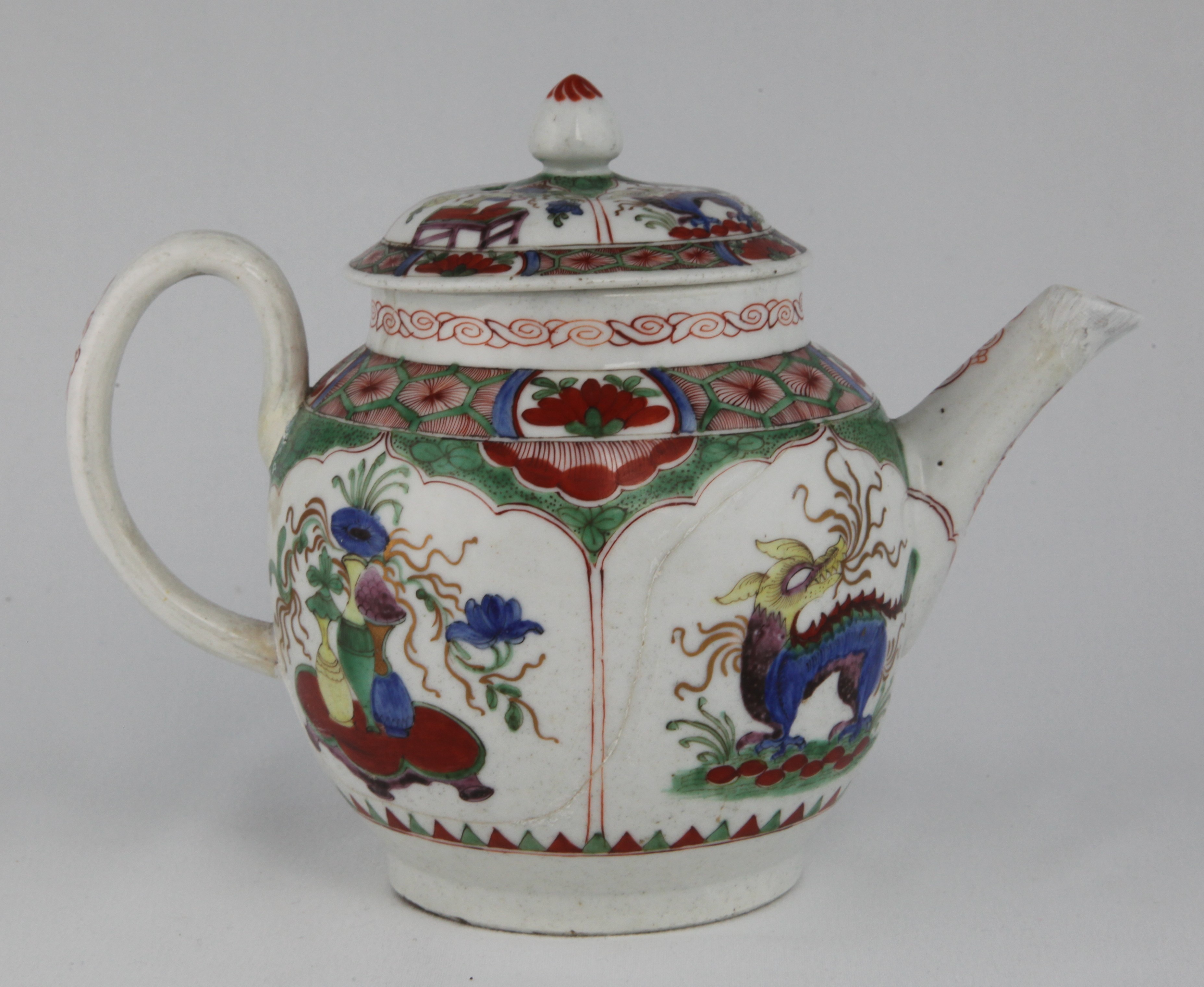 Teapot, from the Dragons in compartments service, decorated by No mark, Plymouth teapot and cover painted with the Dragon in Compartment pattern mark: tin in red (21) — Plymouth & Bristol porcelain piece 1674