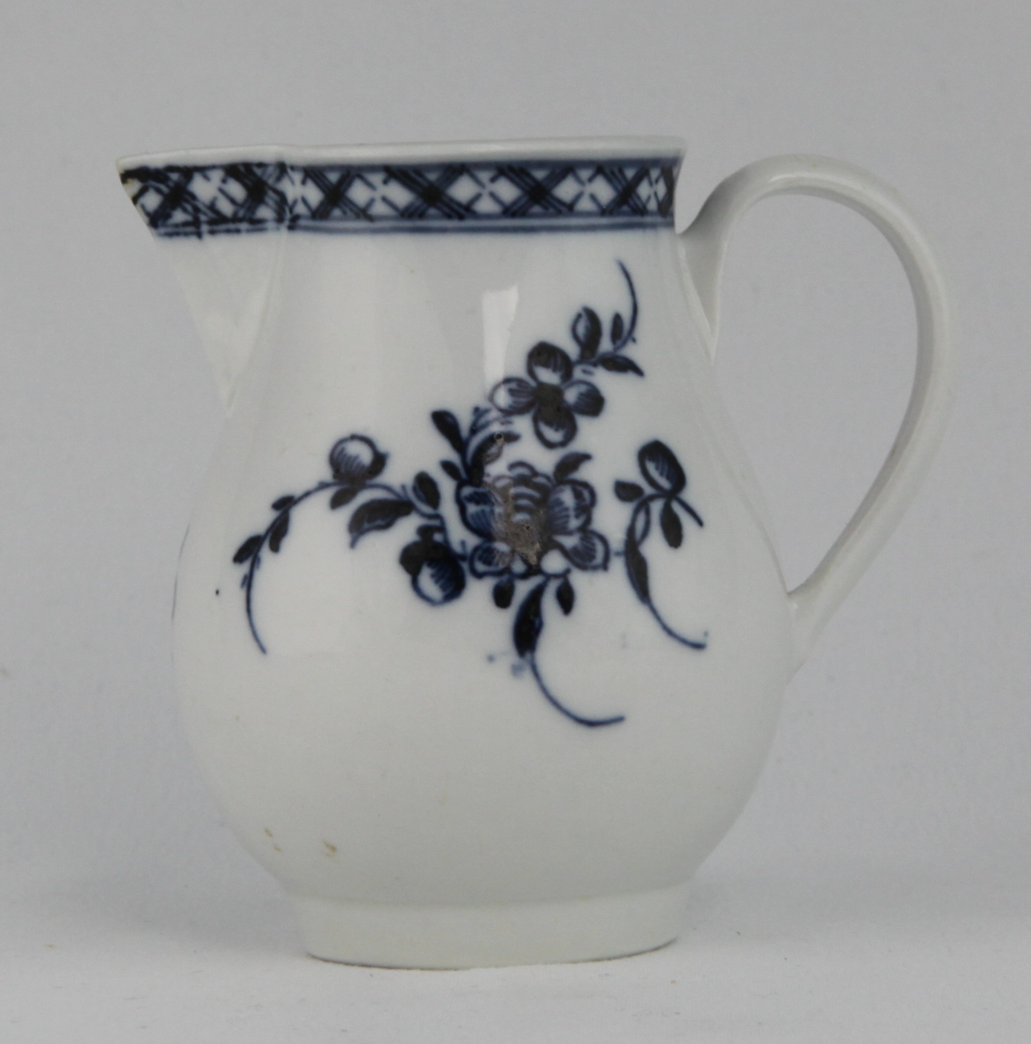Cookworthy sparrowbeak jug painted with flowers under a diaper border, mark X