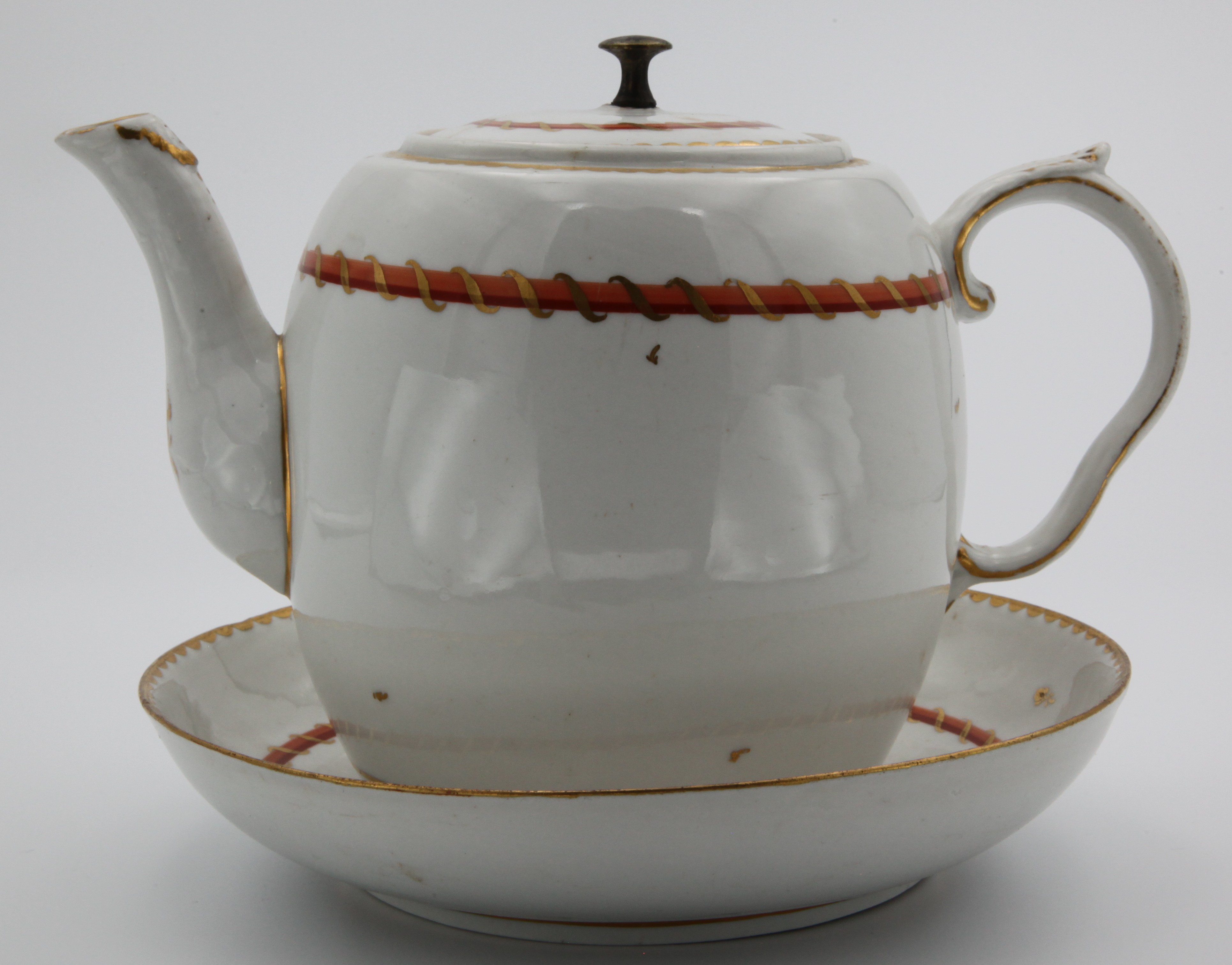 A Bristol barrel-shaped teapot, cover and stand in the colours of the Pitt service.
