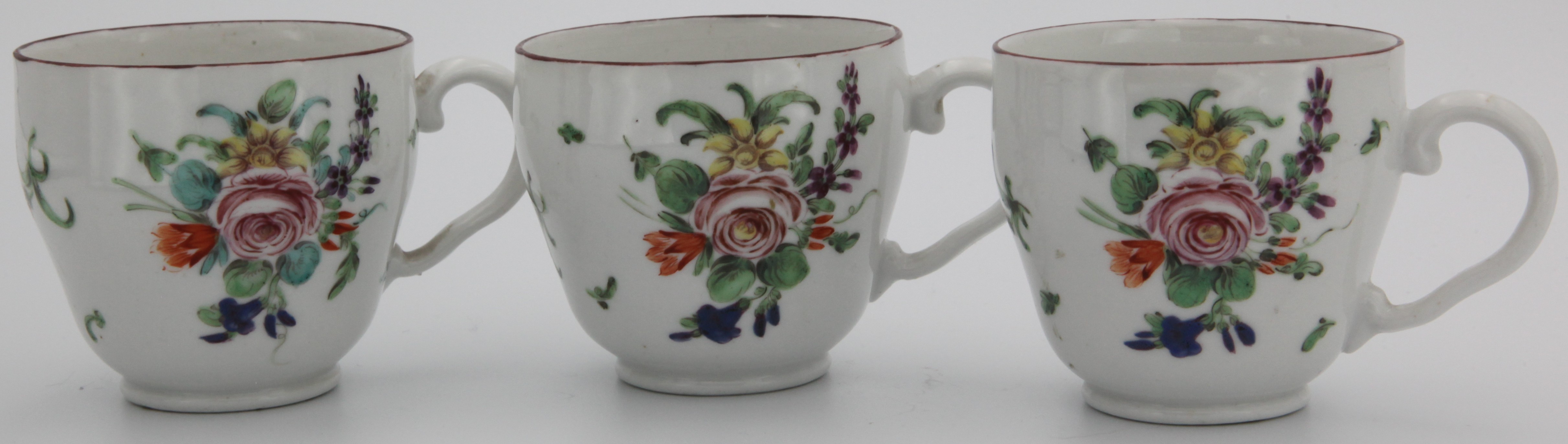 Three cottage Bristol coffee cups, all with both crossed swords and X marks.
