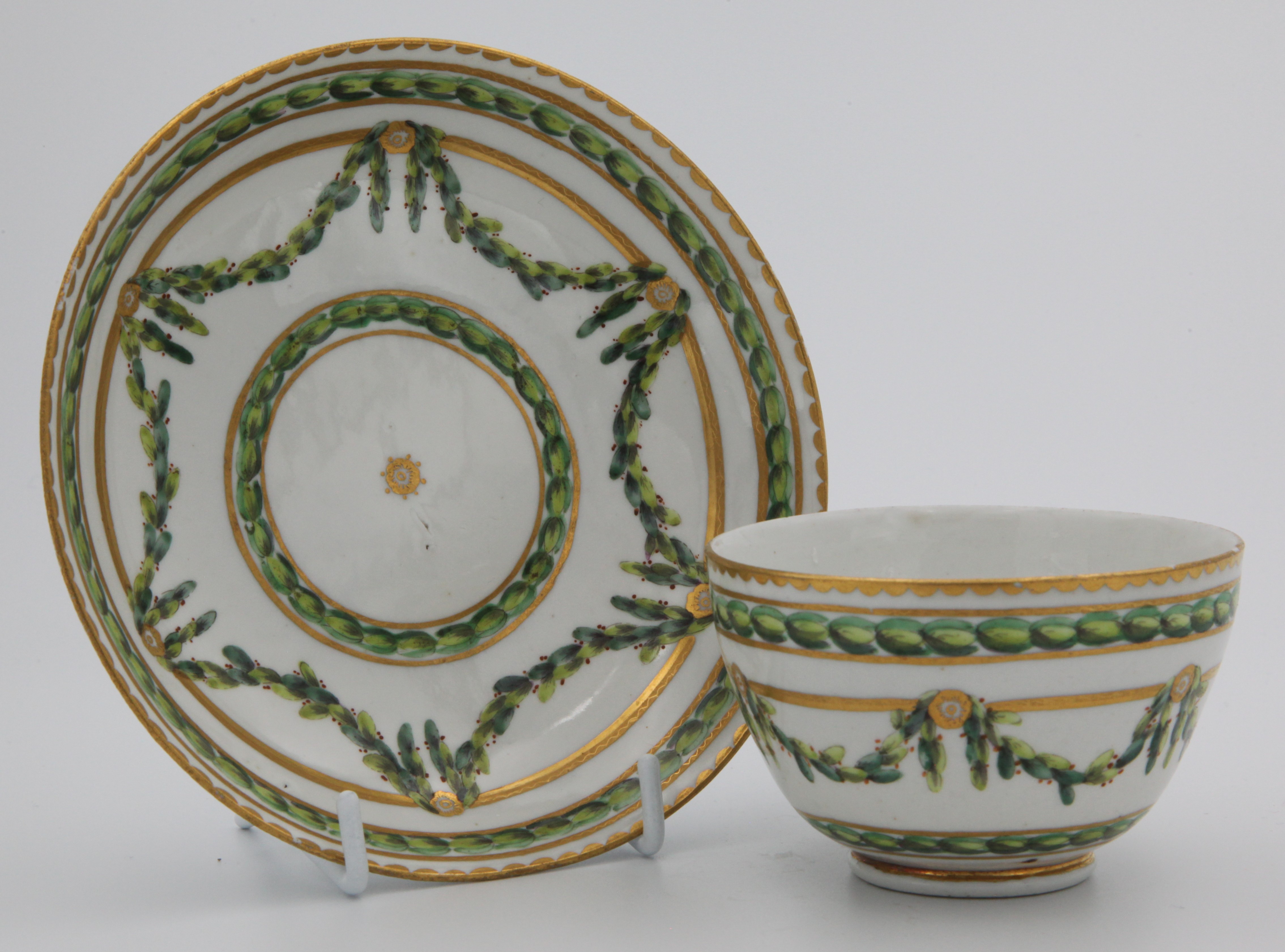 A Bristol teacup and saucer with laurel swags.