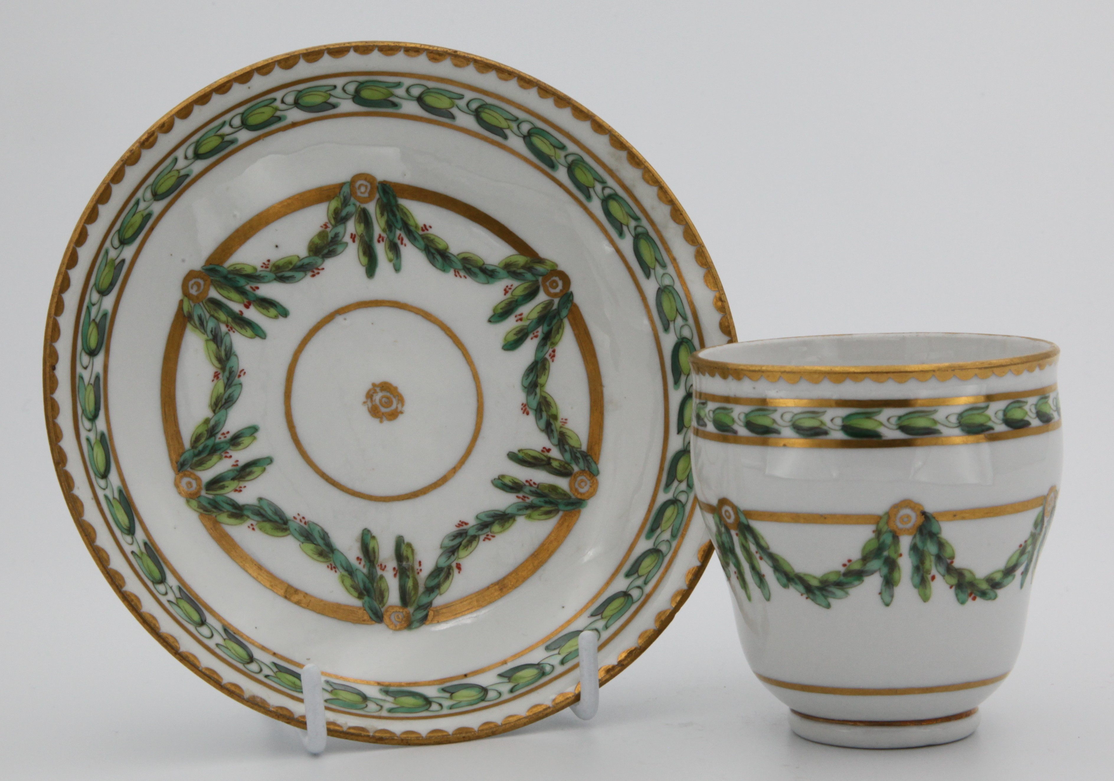 A Bristol coffee cup and saucer with laurel swags.