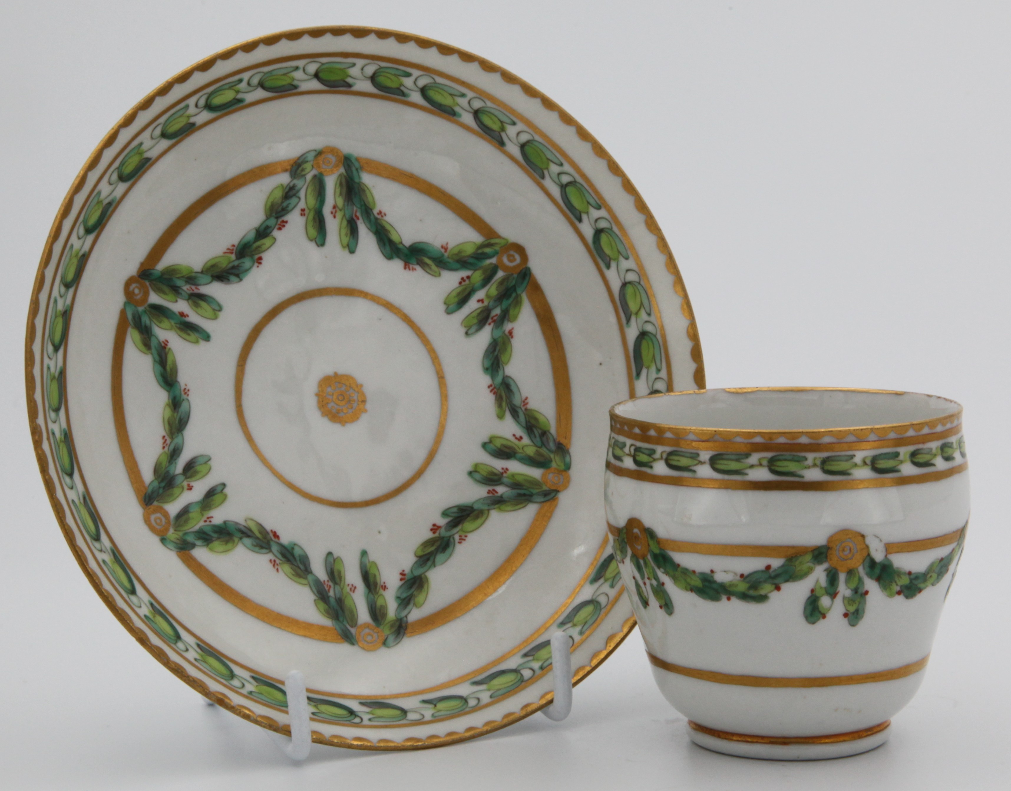 A Bristol coffee cup and saucer with laurel swags.