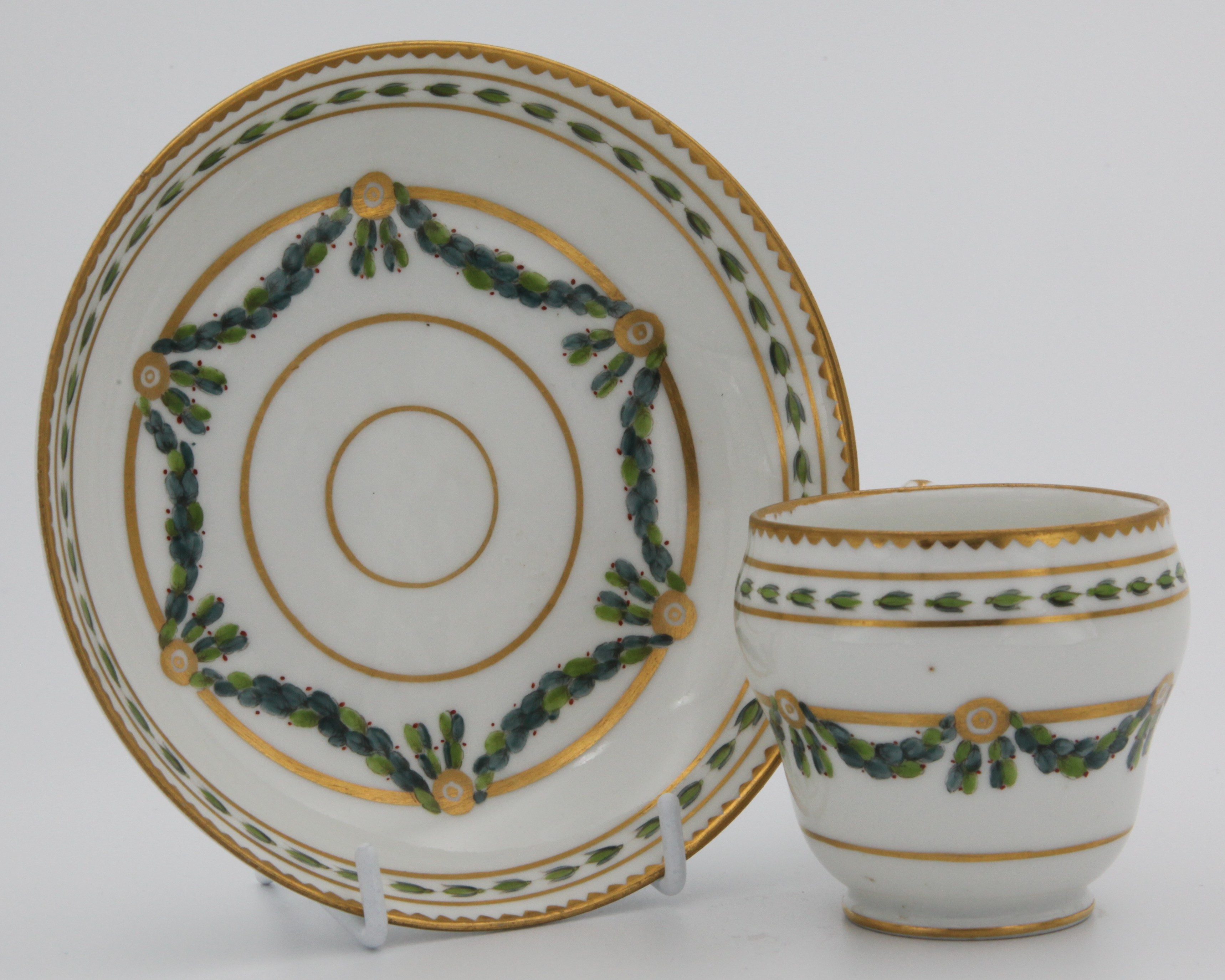 A Bristol coffee cup and saucer with laurel swags.
