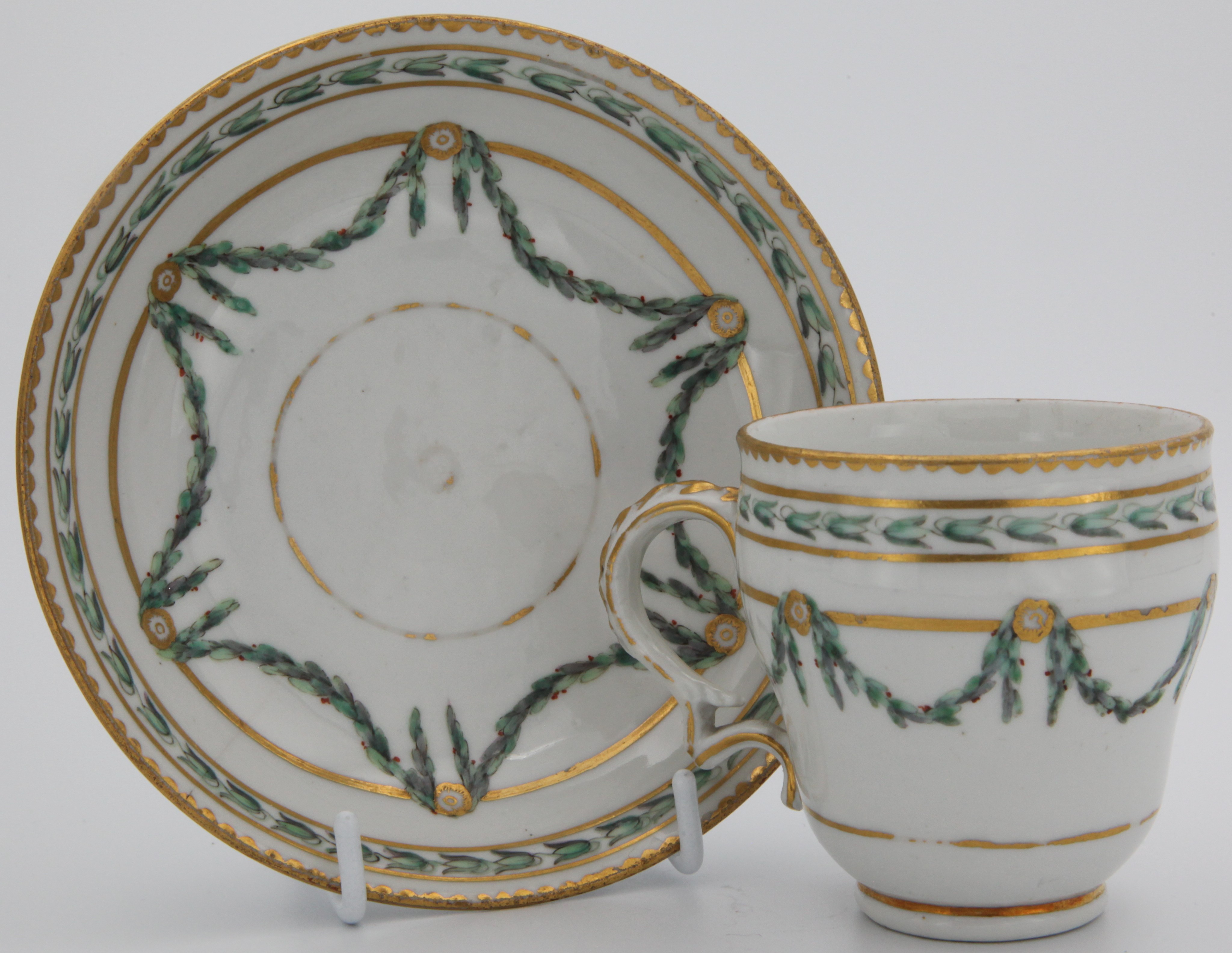 A Bristol coffee cup and saucer with laurel swags.