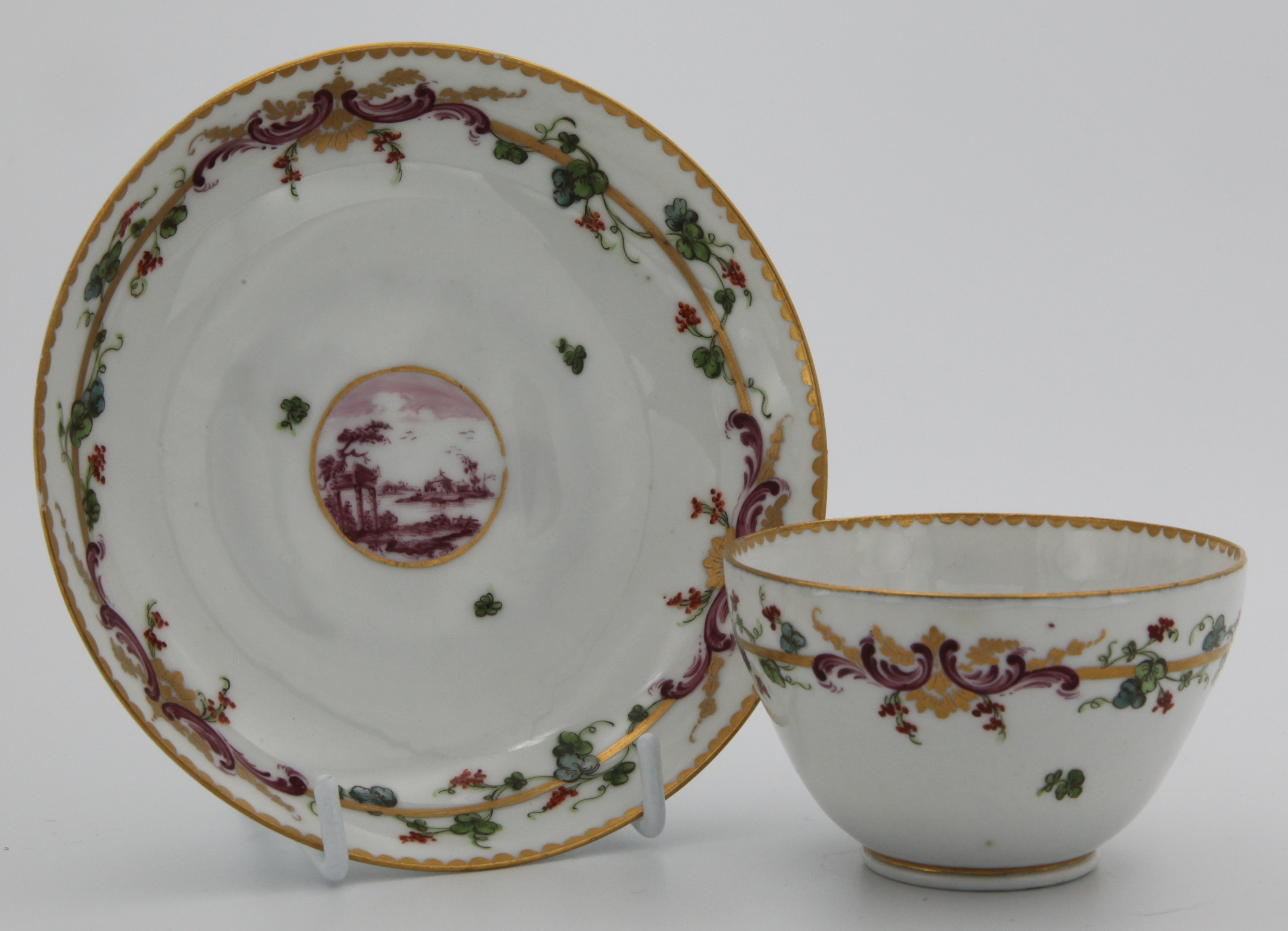 A Bristol tea bowl and saucer from the Mark Harford service.