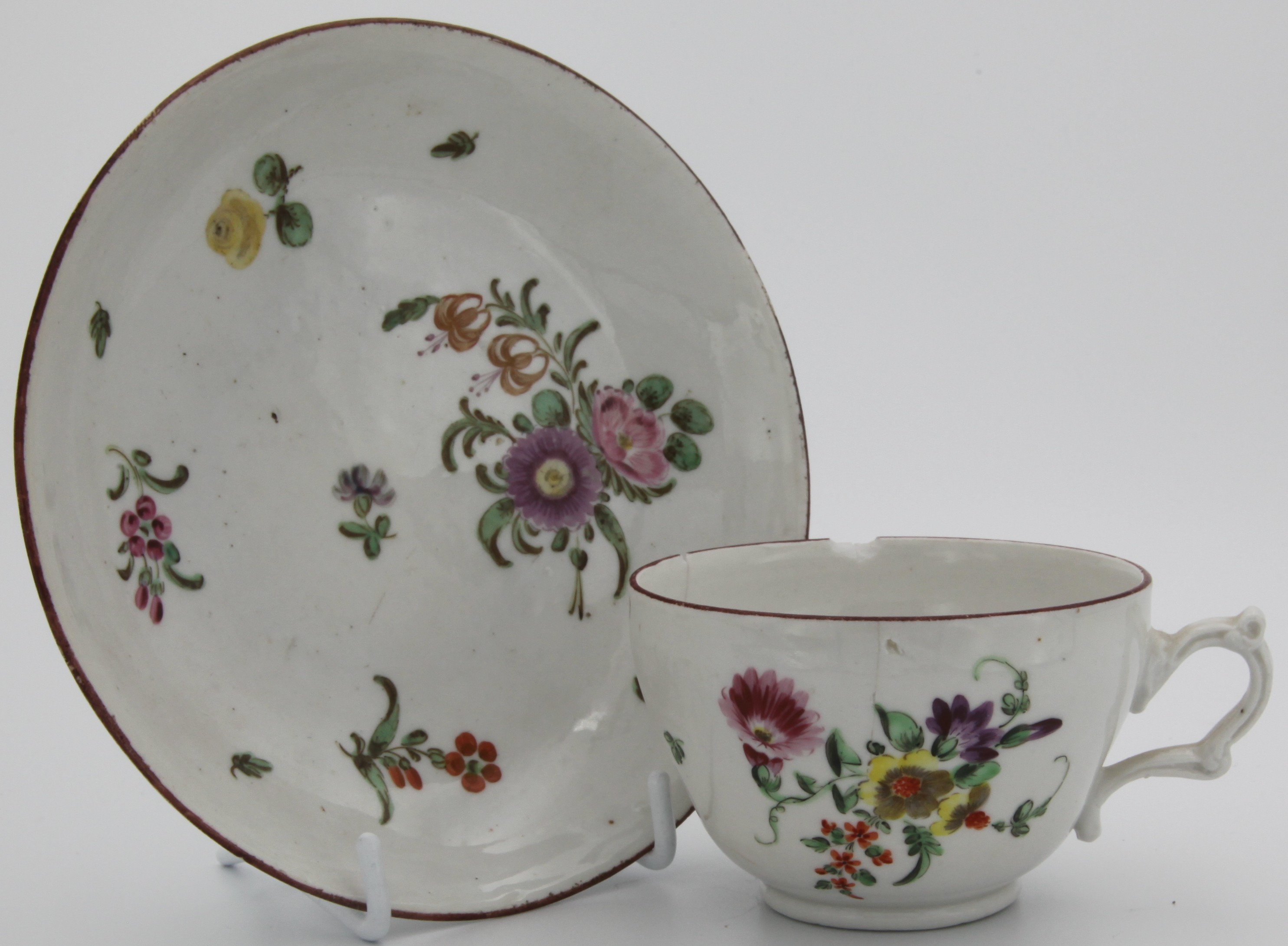 A cottage Bristol tea cup and saucer