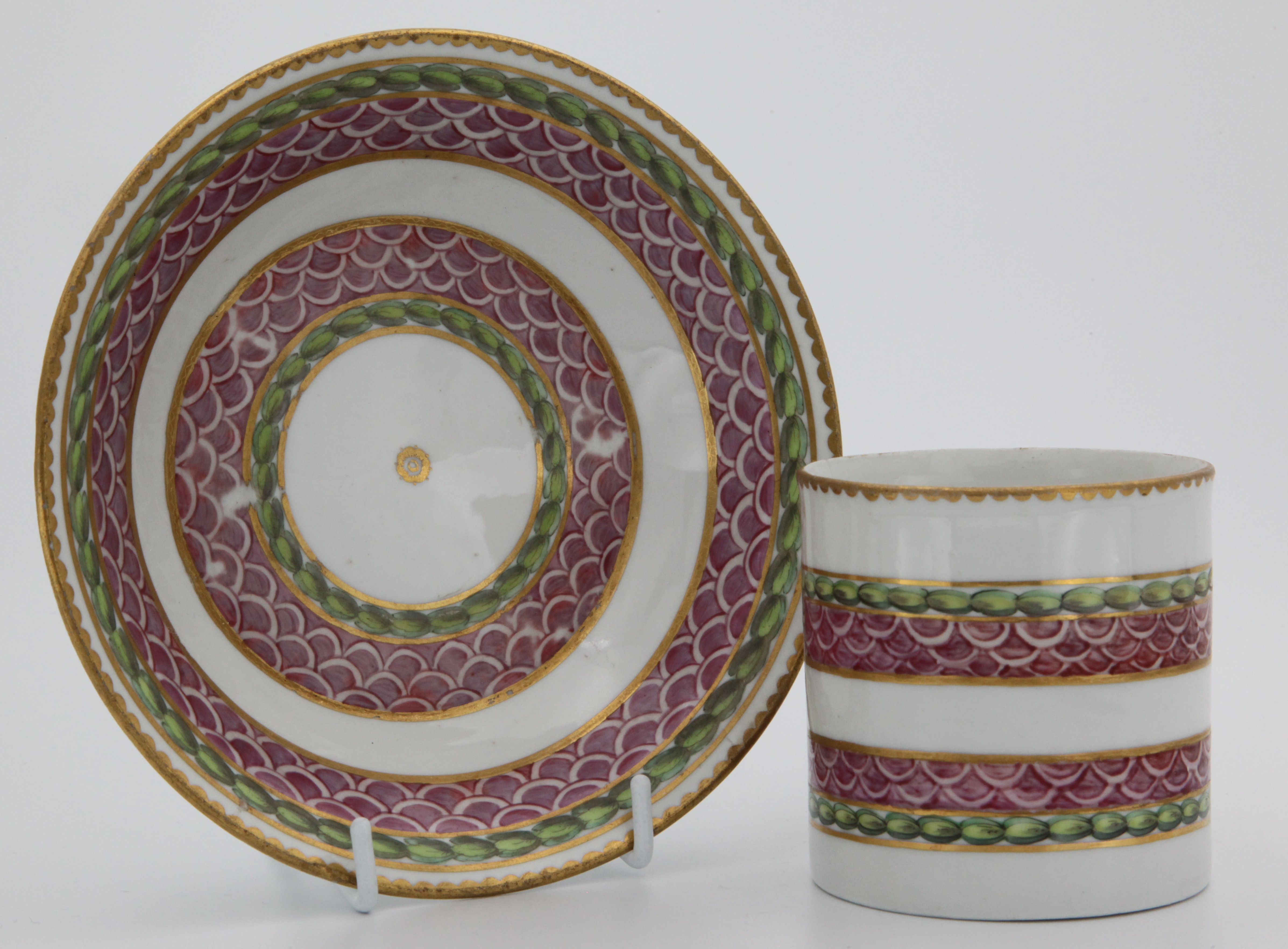 A fine Bristol cabinet cup and saucer with bands of pink scale, gilding and laurel.