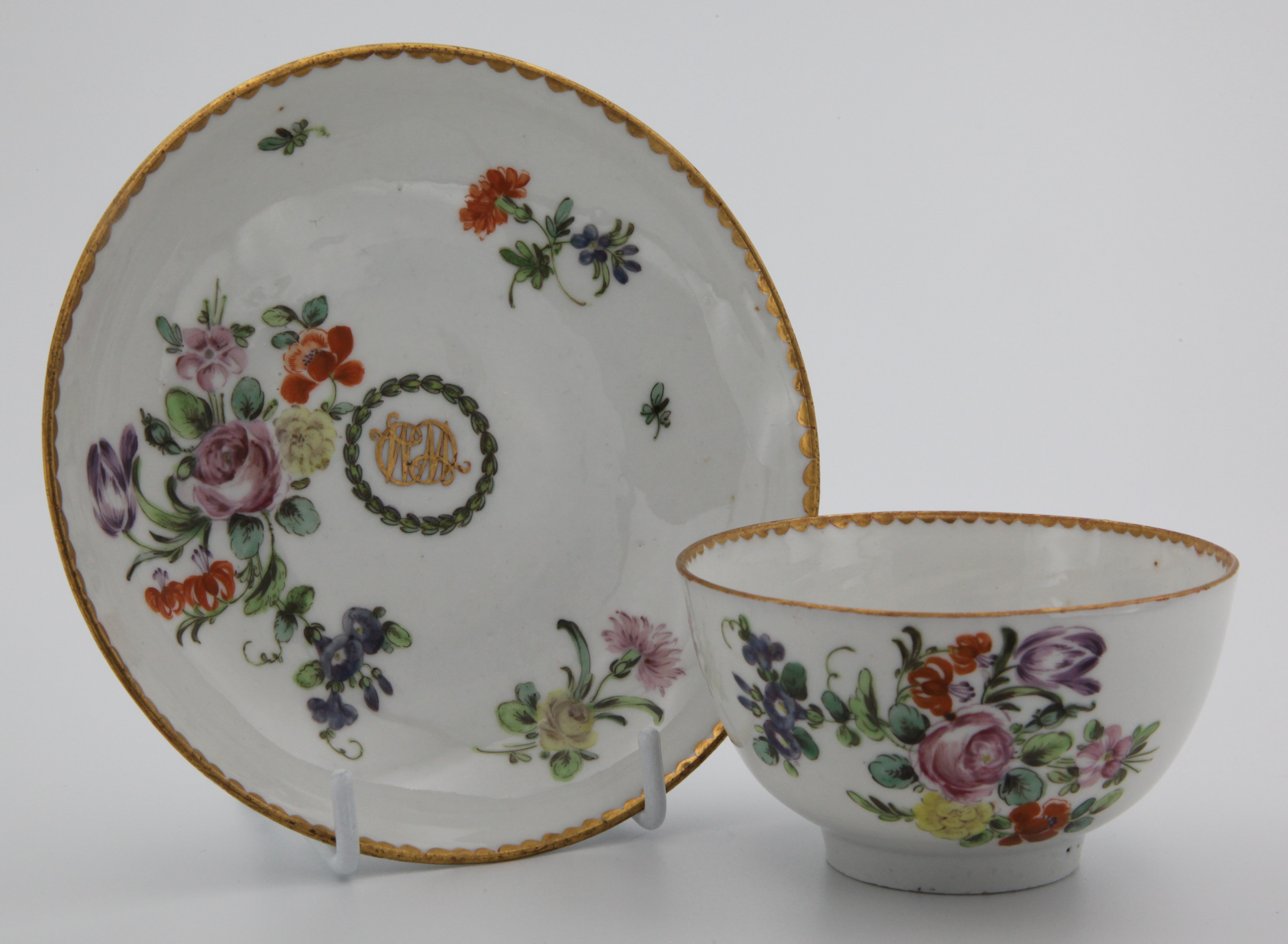 A fine tea bowl and saucer from the William Cowles service.