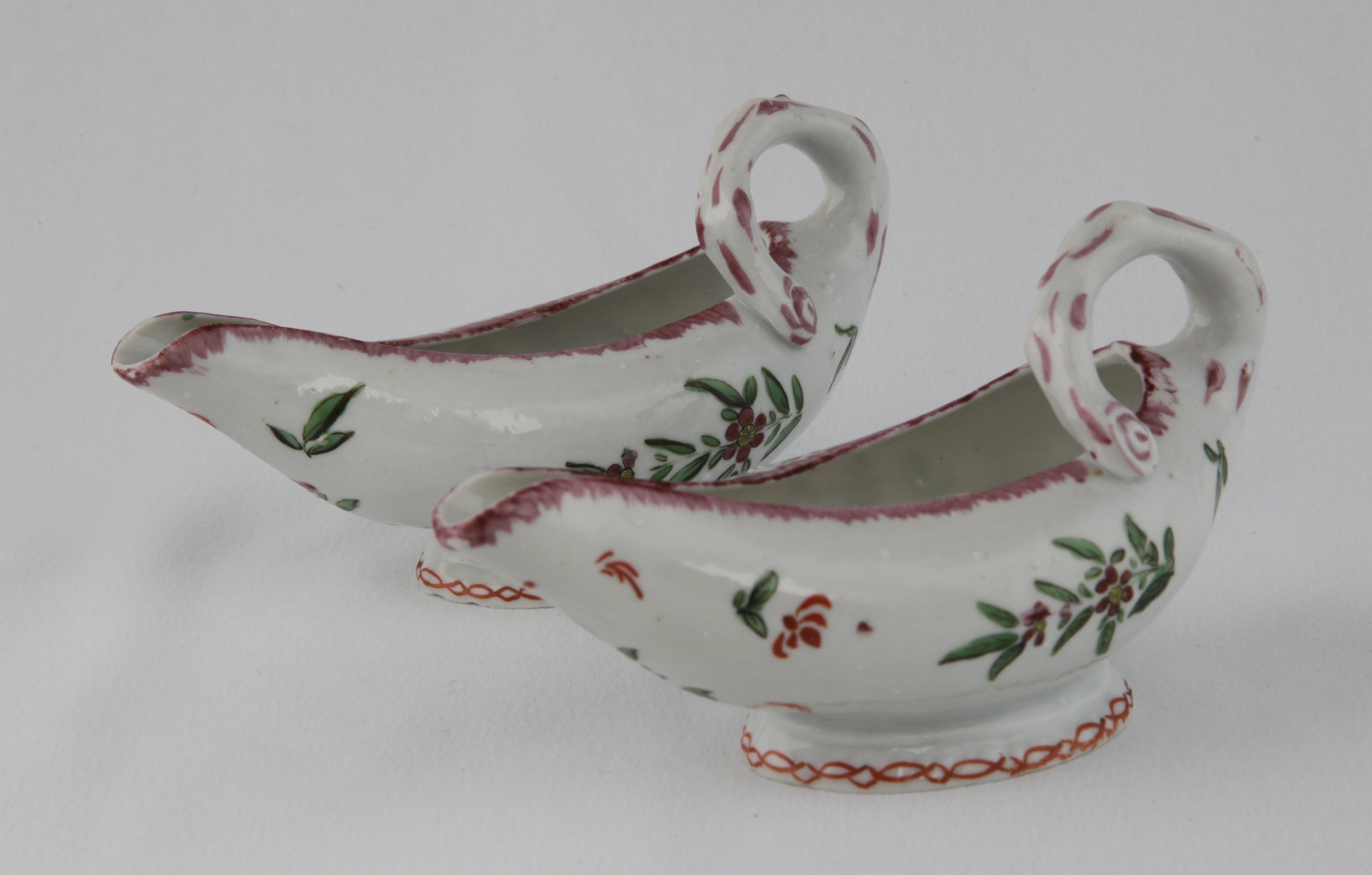 A pair of Bristol leaf-shaped sauceboats